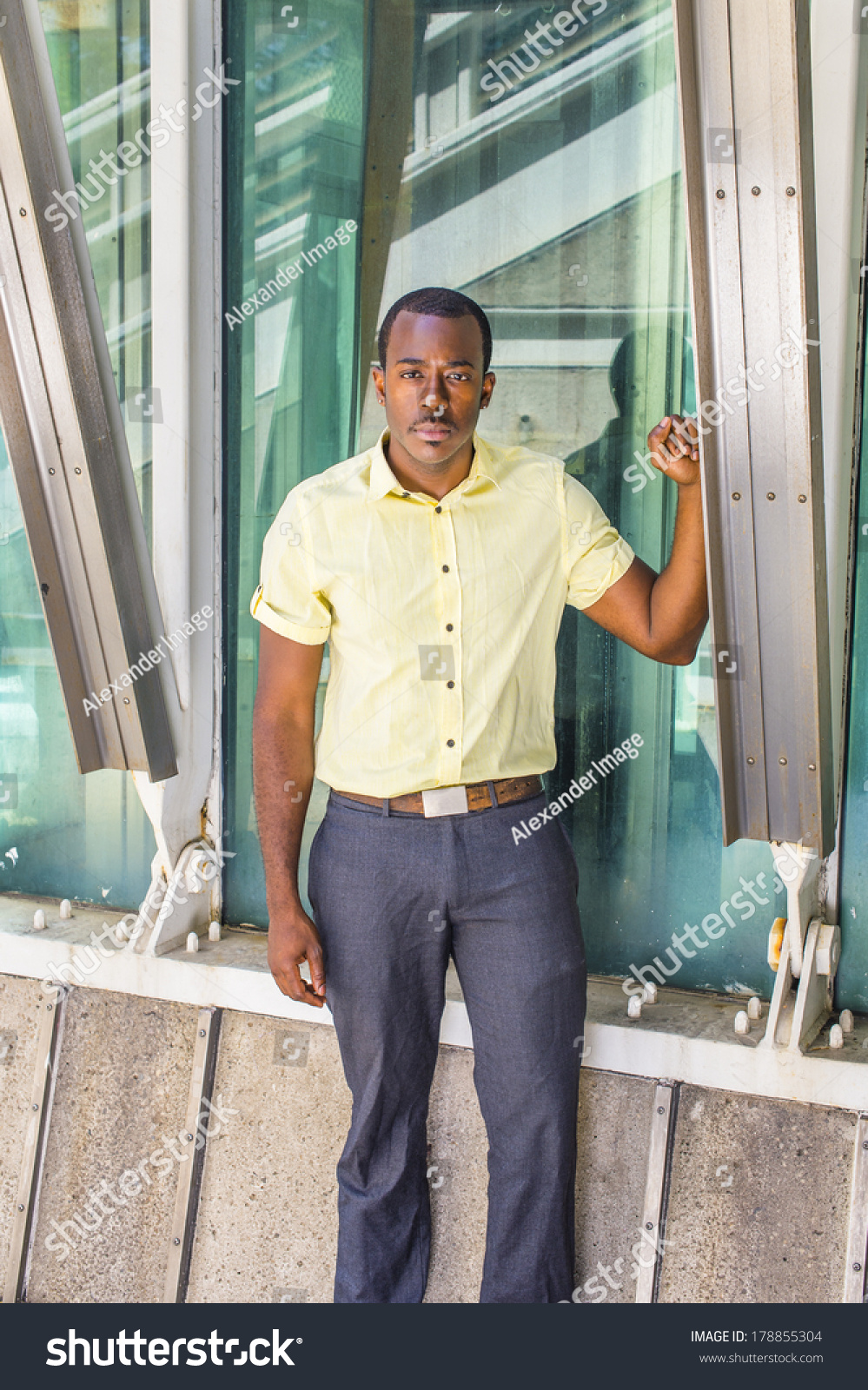 yellow shirt gray pants