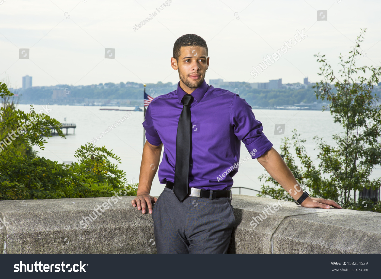 purple shirt and grey pants