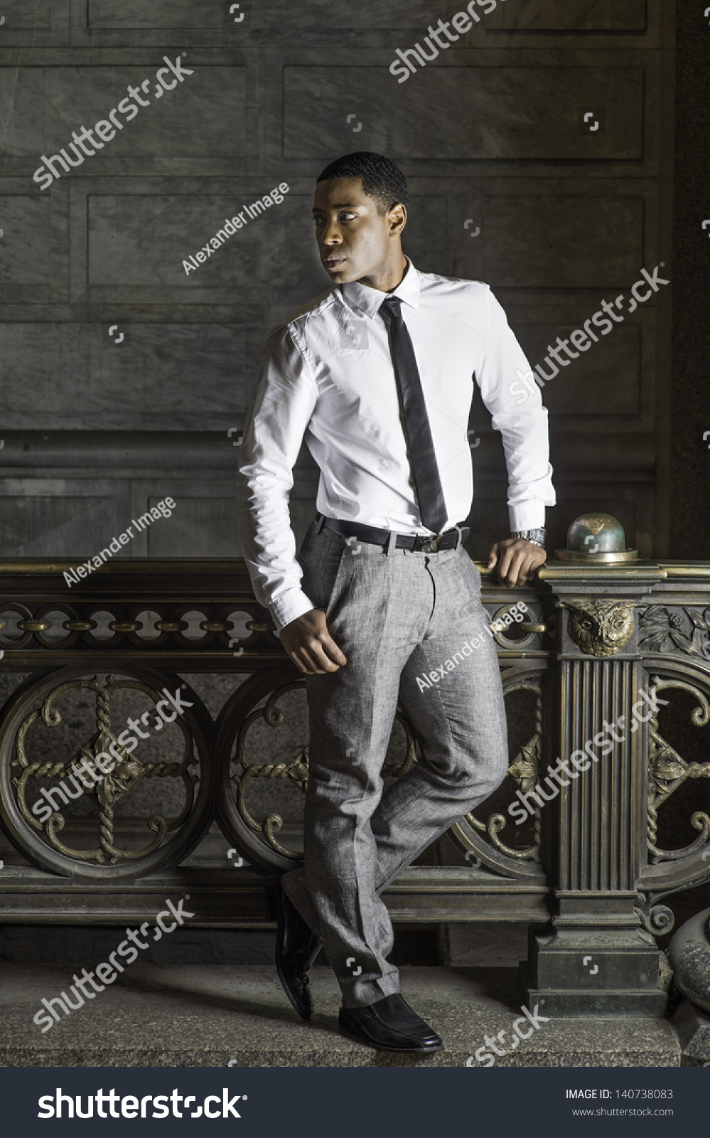 grey pants white shirt black tie