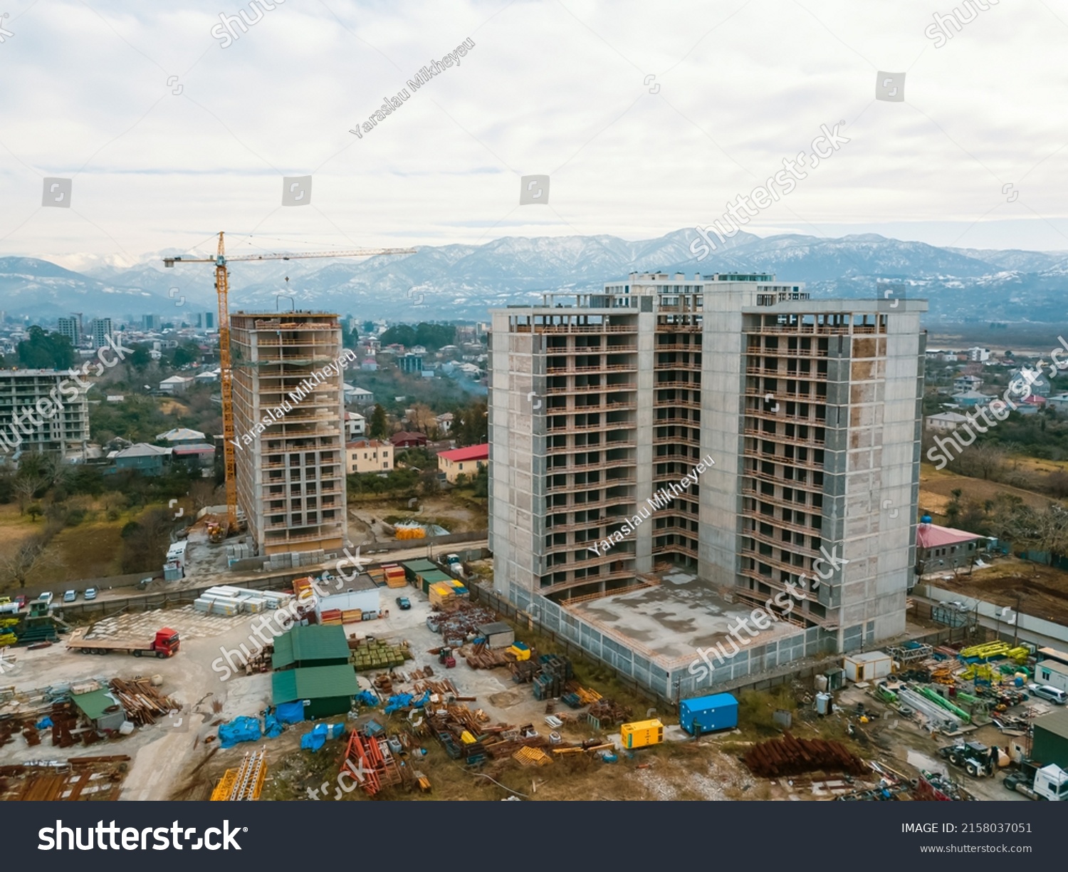 stock-photo-drone-view-of-the-construction-site-multi-storey-buildings-under-construction-against-the-2158037051.jpg