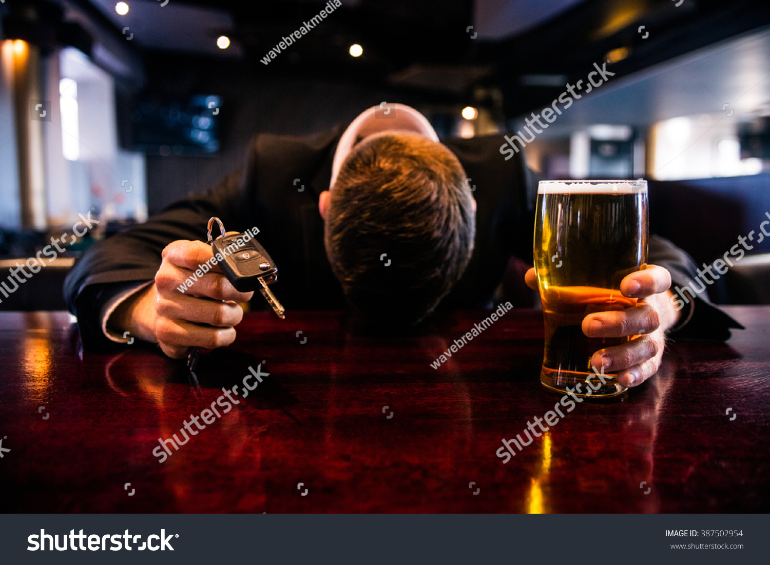 Drunk Man Holding A Beer And Car Keys In A Bar Stock Photo 387502954 ...