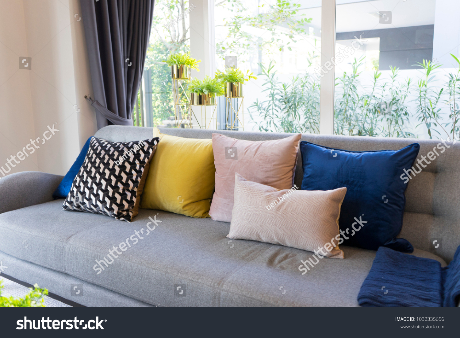 stock-photo-eclectic-style-of-living-room-with-grey-sofa-and-colorful-pillows-1032335656.jpg