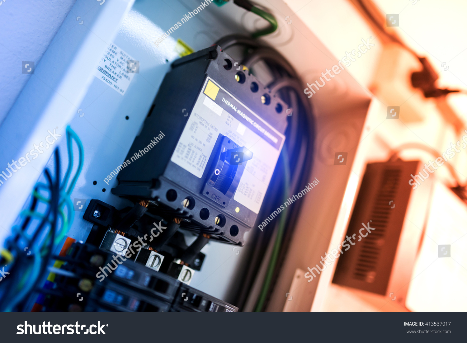 Electric outdoor fuse box in soft light .