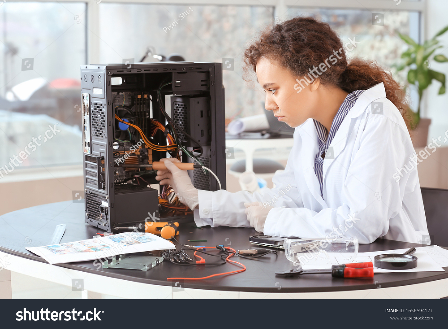 electronic-technician-working-service-center-stock-photo-1656694171