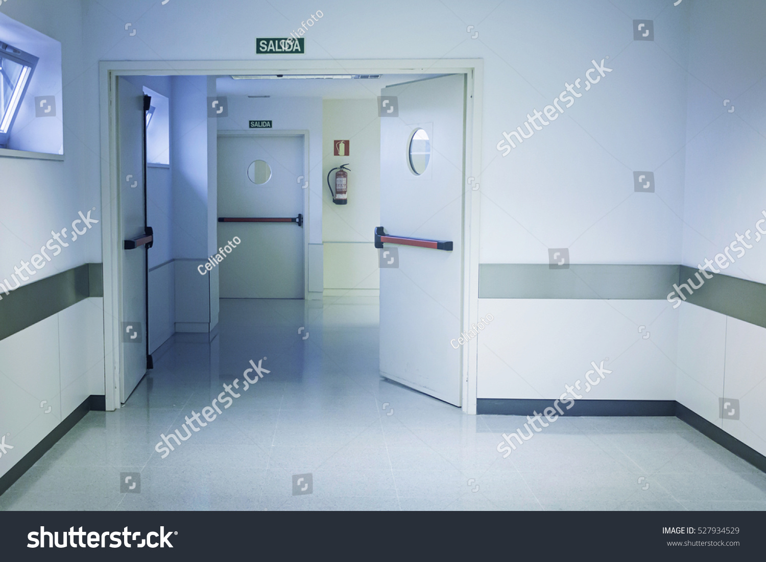 stock-photo-empty-hospital-hall-with-white-walls-medicine-527934529.jpg