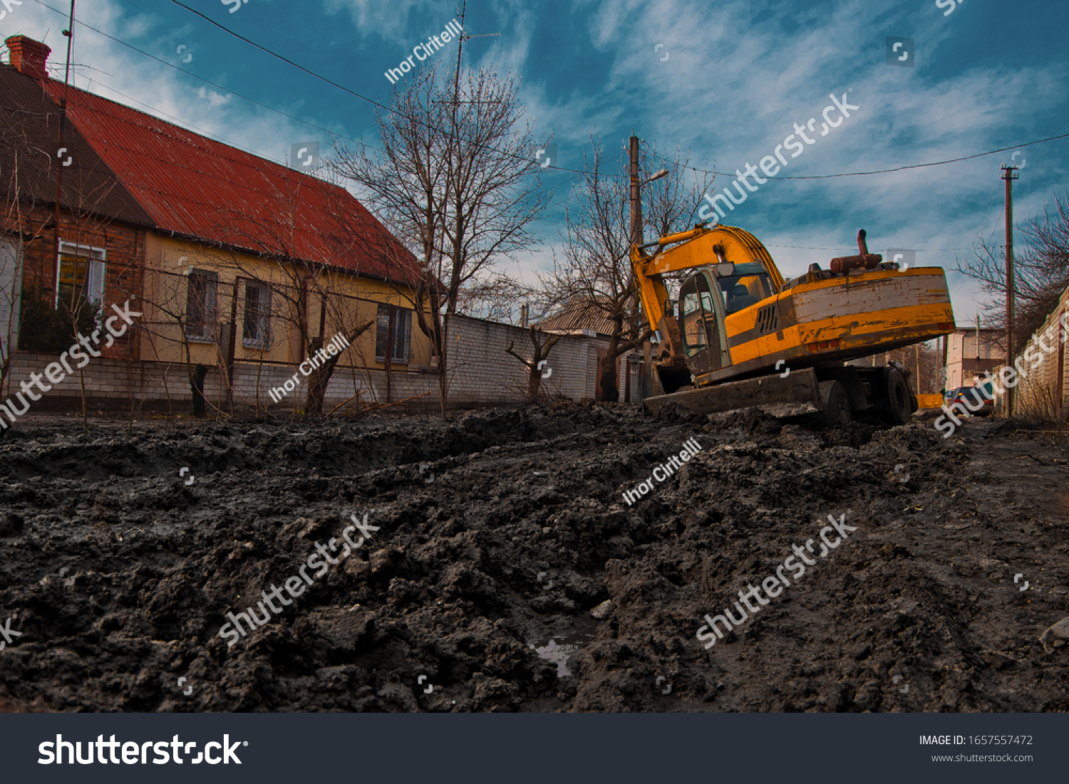 Excavator Stuck Mud Near Residential Buildings Stock Photo Edit Now 1657557472