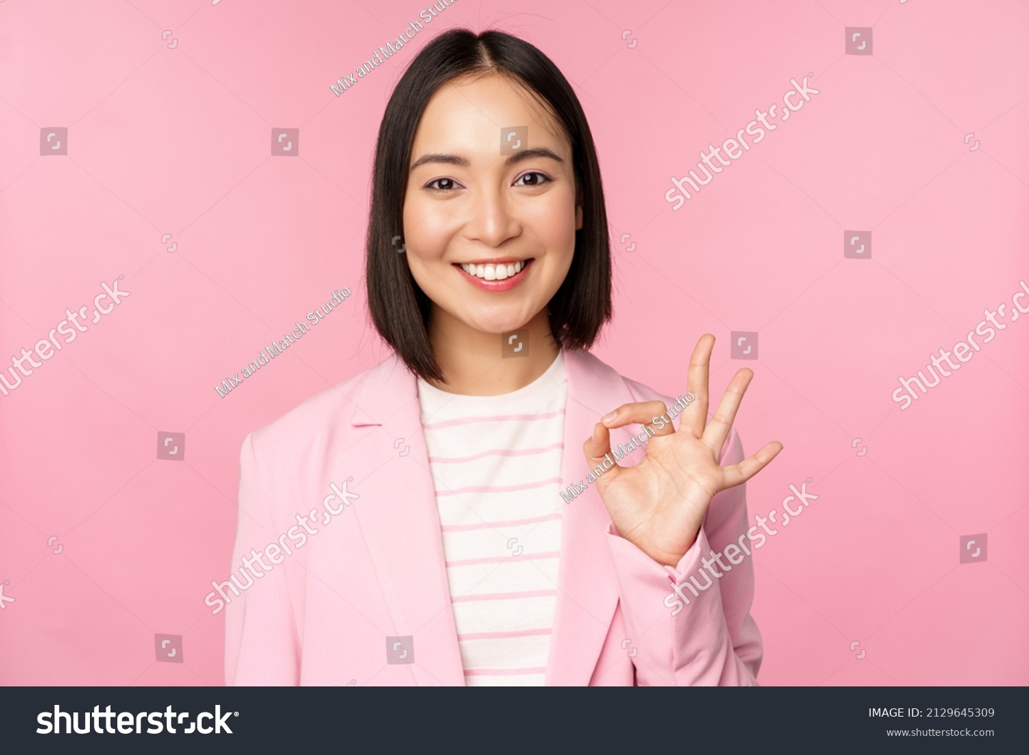 excellent-work-well-done-gesture-smiling-stock-photo-2129645309