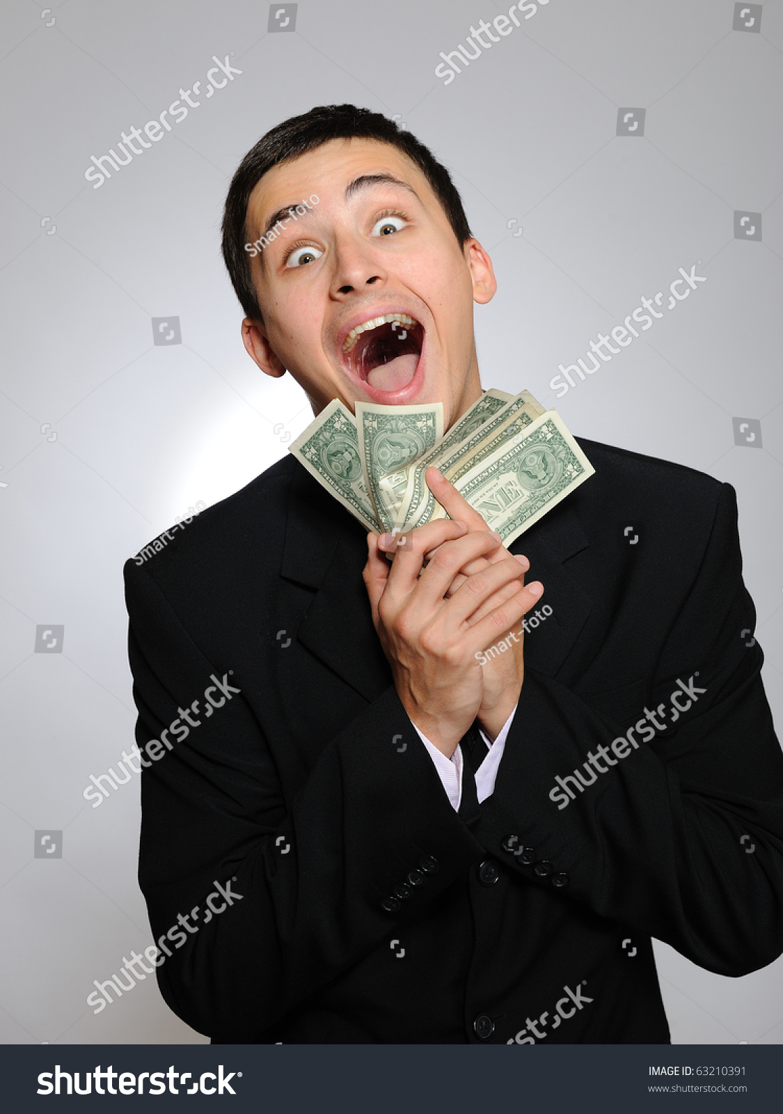 Expressions - Young Handsome Business Man In Black Suit And Tie ...