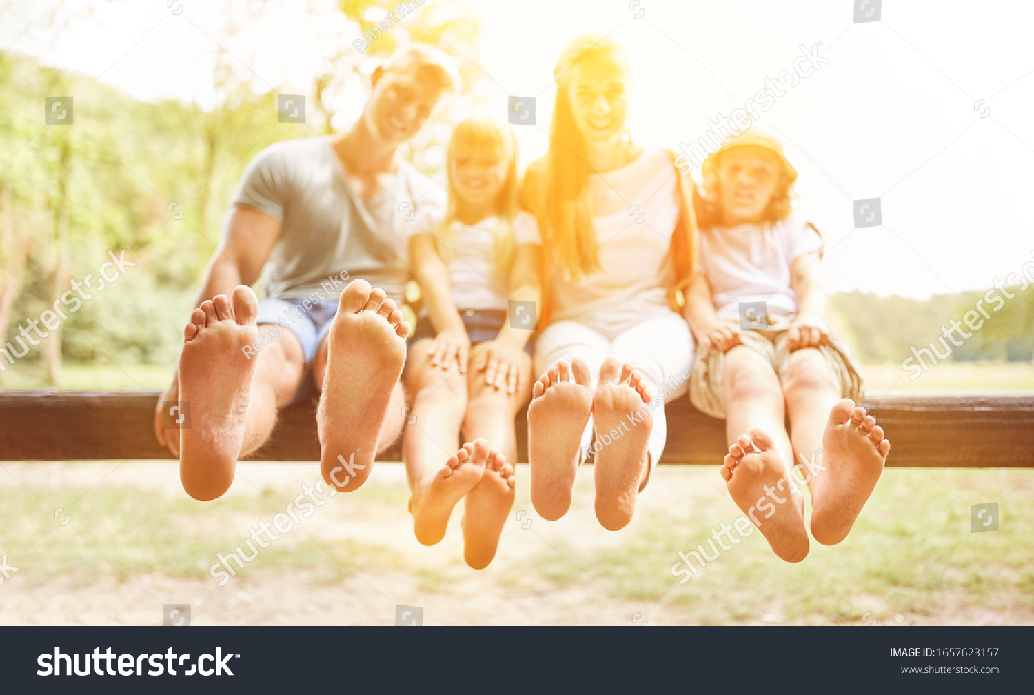 Family Children On Vacation Sitting Barefoot Stock Photo 1657623157 ...