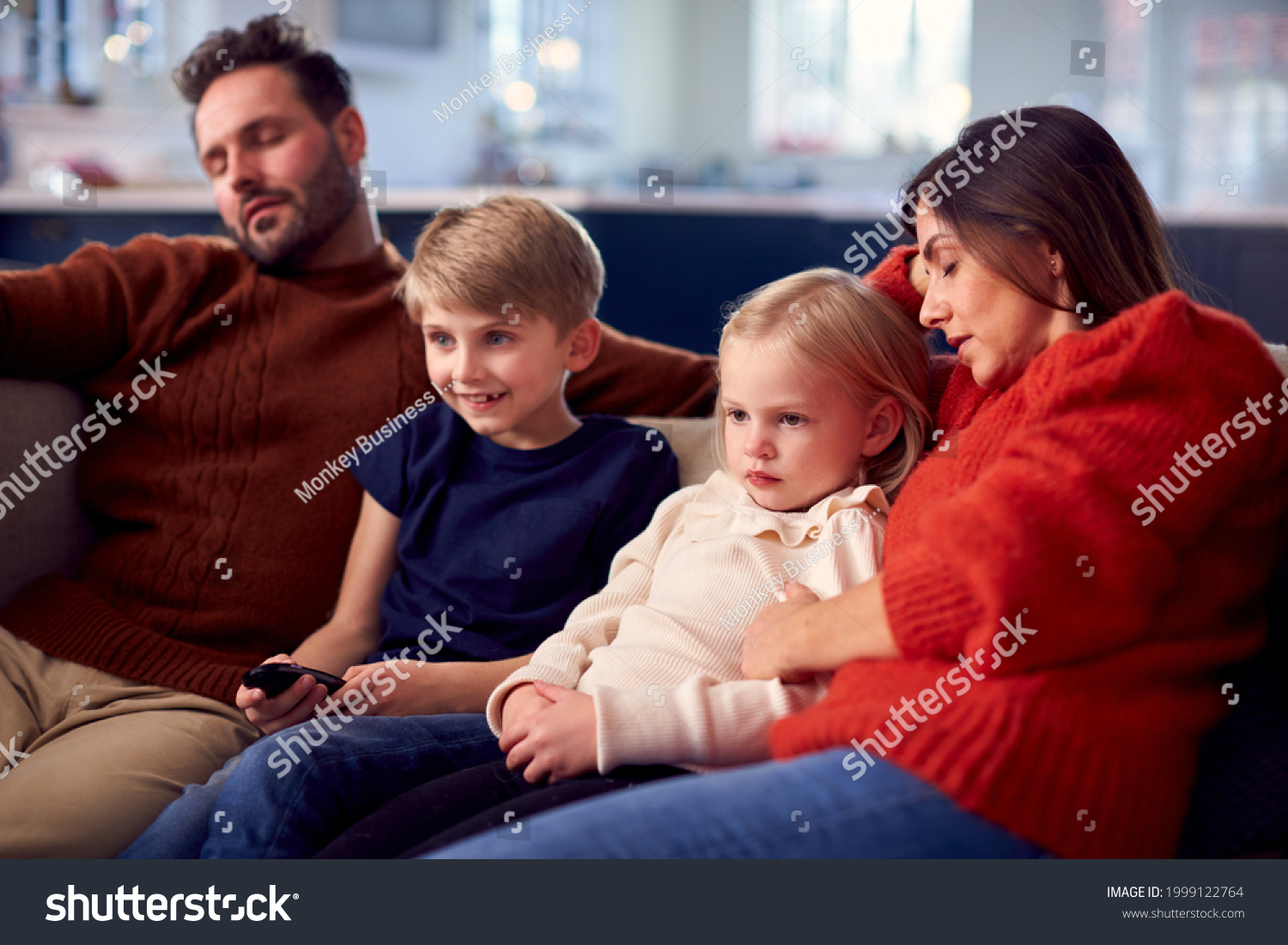 Family Sitting On Sofa Watching Tv Stock Photo 1999122764 Shutterstock   Stock Photo Family Sitting On Sofa Watching Tv Together As Parents Fall Asleep 1999122764 