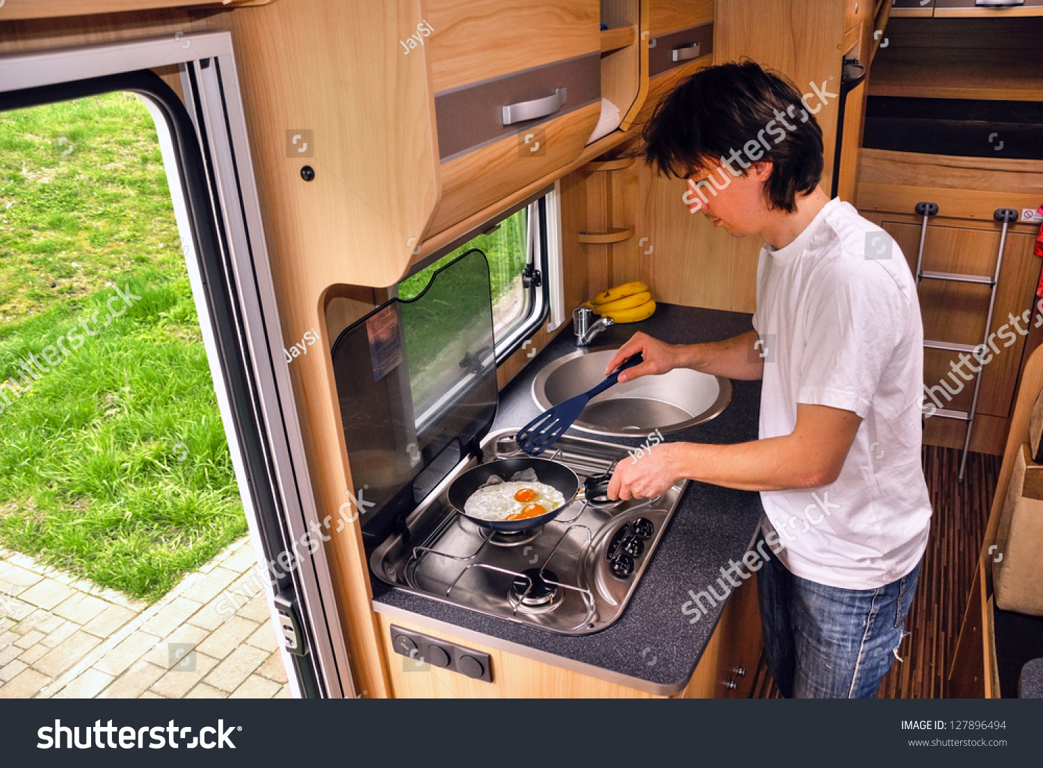 Family Vacation Rv Holiday Trip Man Stock Photo 127896494 ... Family vacation, RV holiday trip, man cooking in camper. Motorhome interior