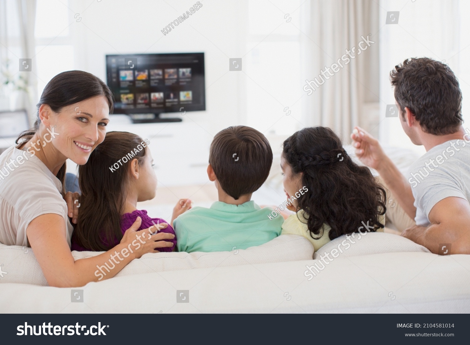 Family Watching Tv Living Room Stock Photo 2104581014 Shutterstock   Stock Photo Family Watching Tv In Living Room 2104581014 