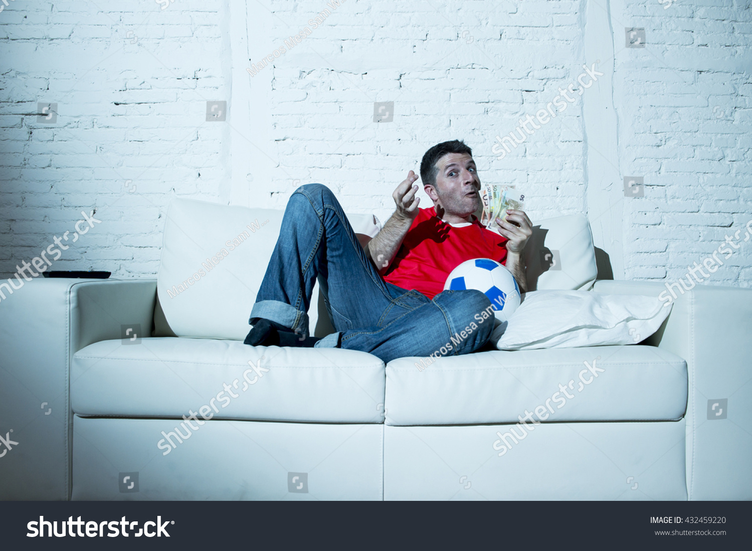 Fanatic Man Lying Happy On Sofa Stock Photo Edit Now 432459220