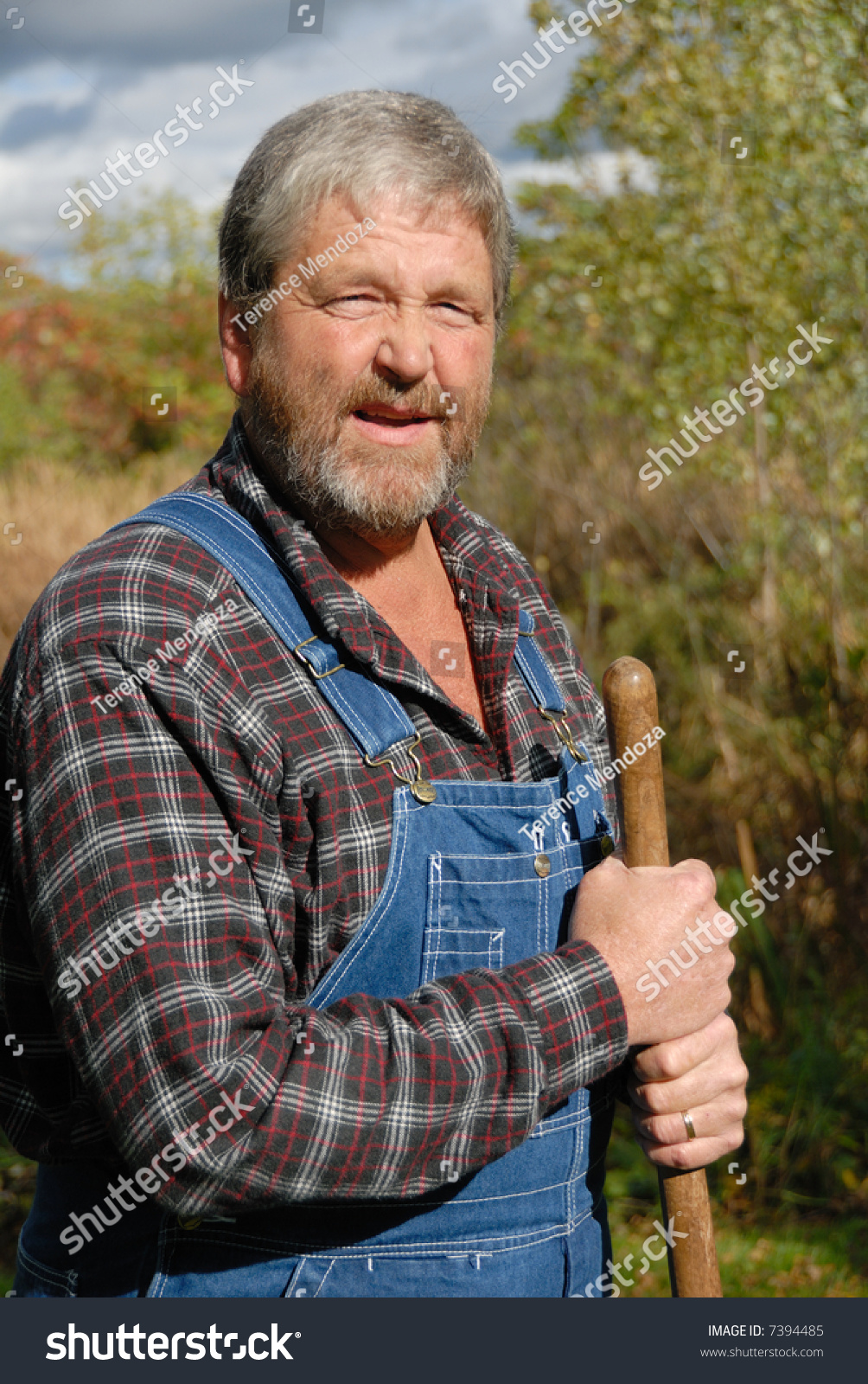 Farmer With Spade In Blue Bib Overalls Stock Photo 7394485 : Shutterstock