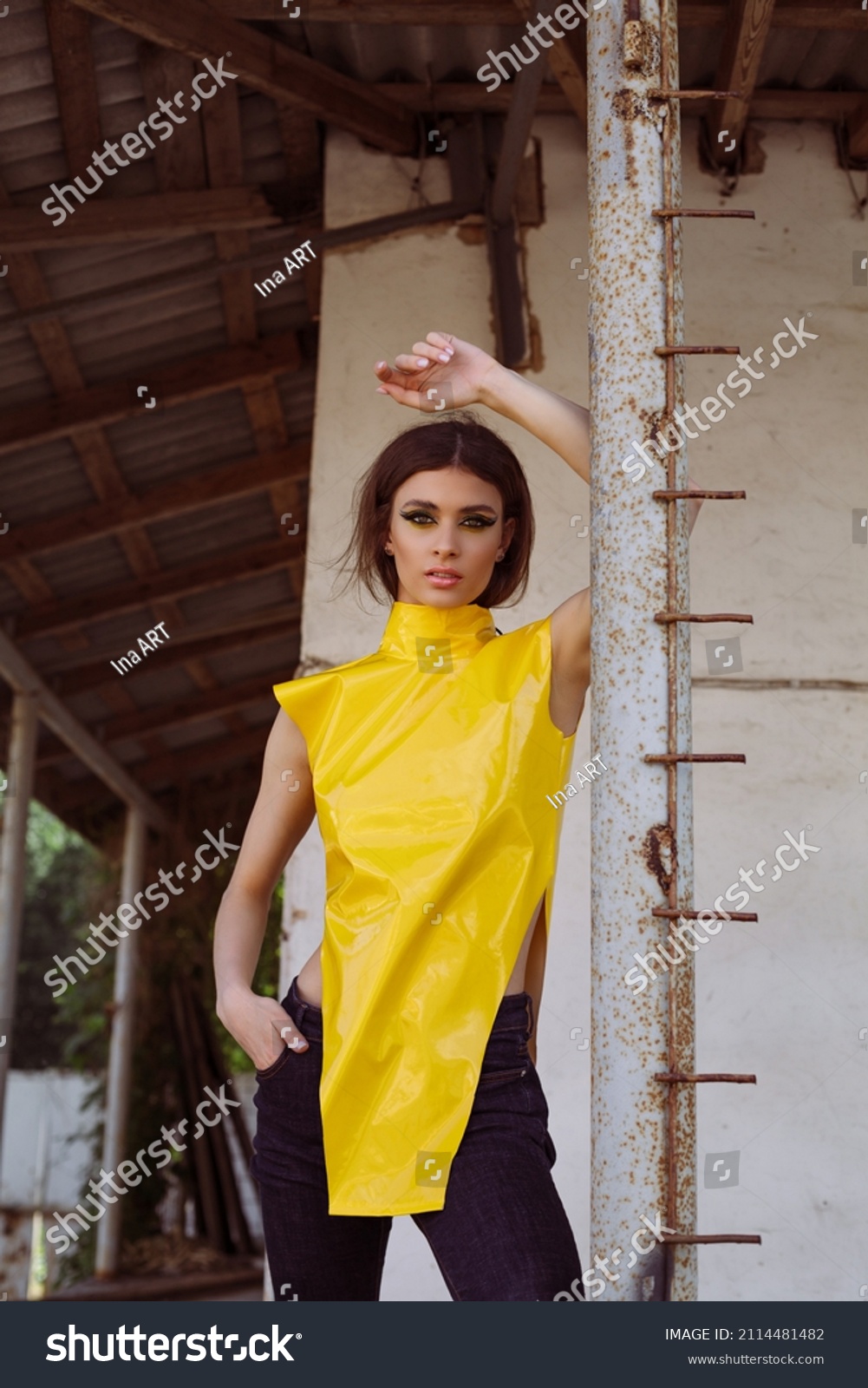 yellow sleeveless turtleneck