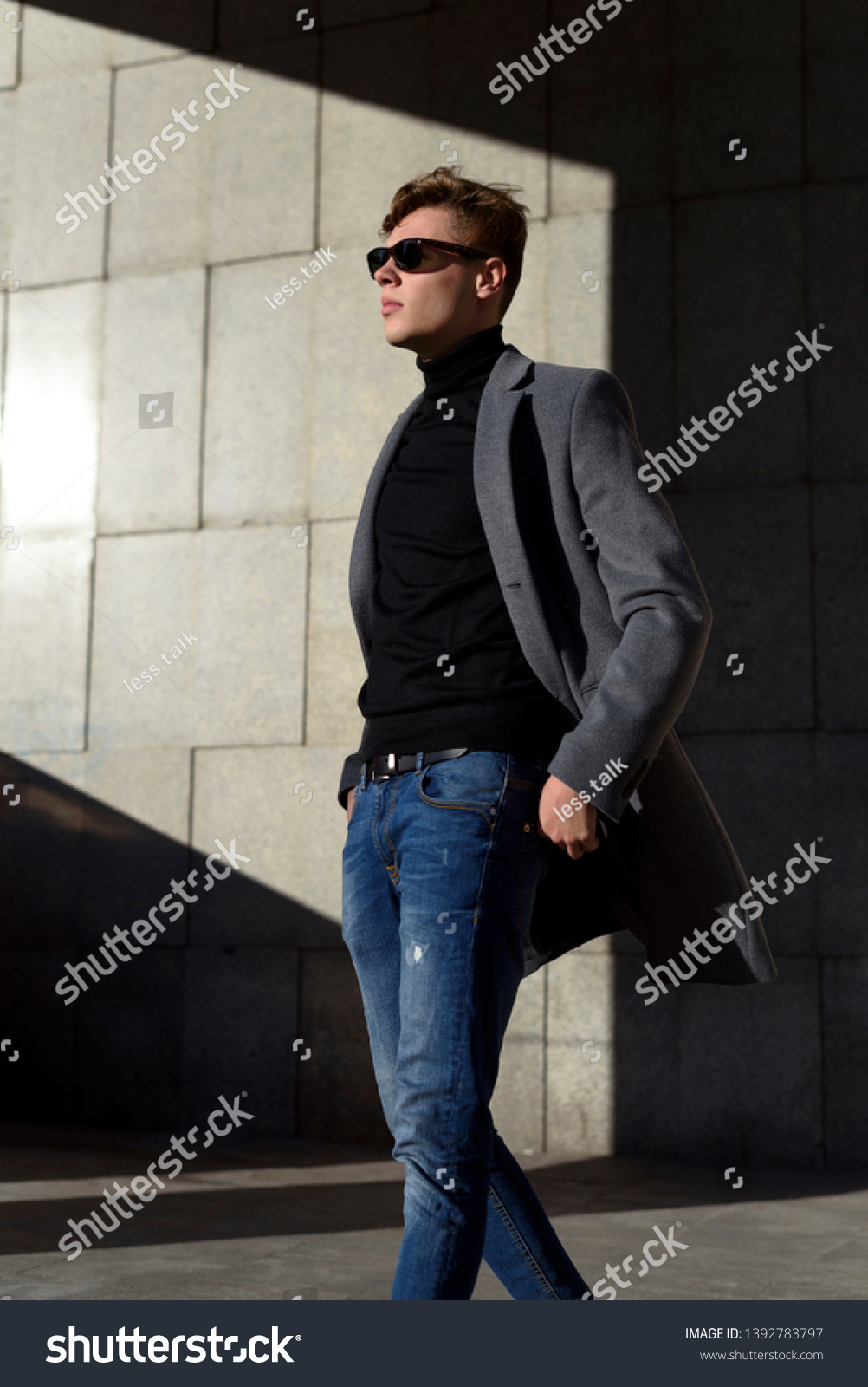 black polo and brown shoes