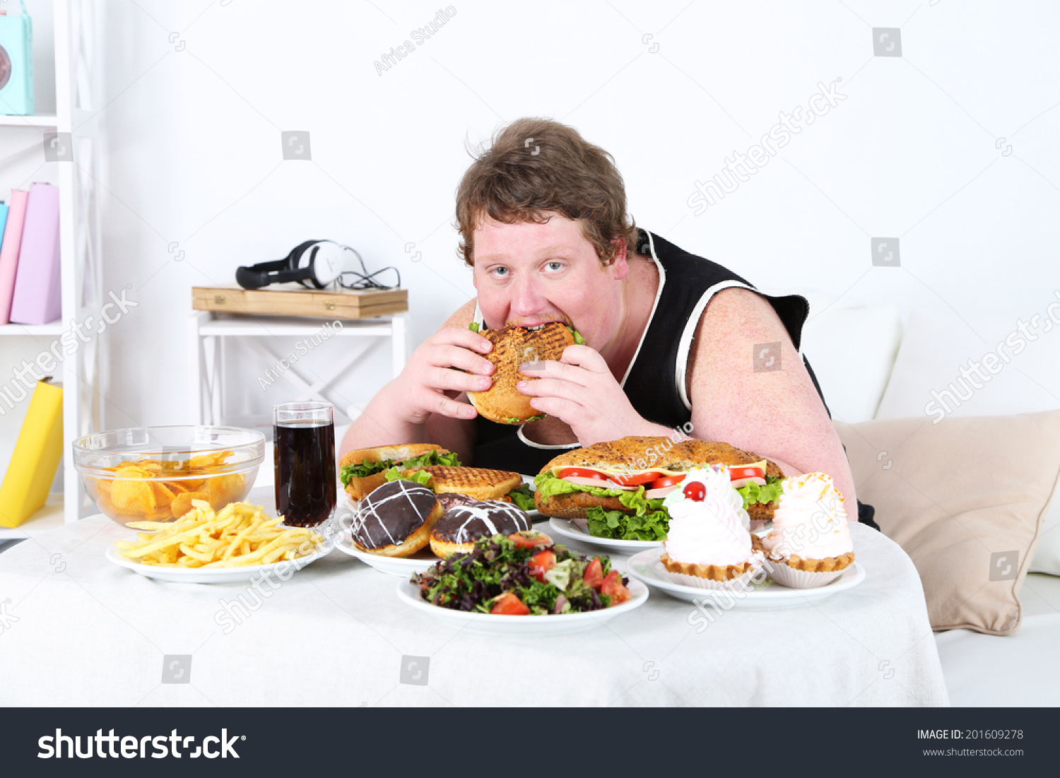 Fat Man Eating A Lot Of Unhealthy Food, On Home Interior Background ...