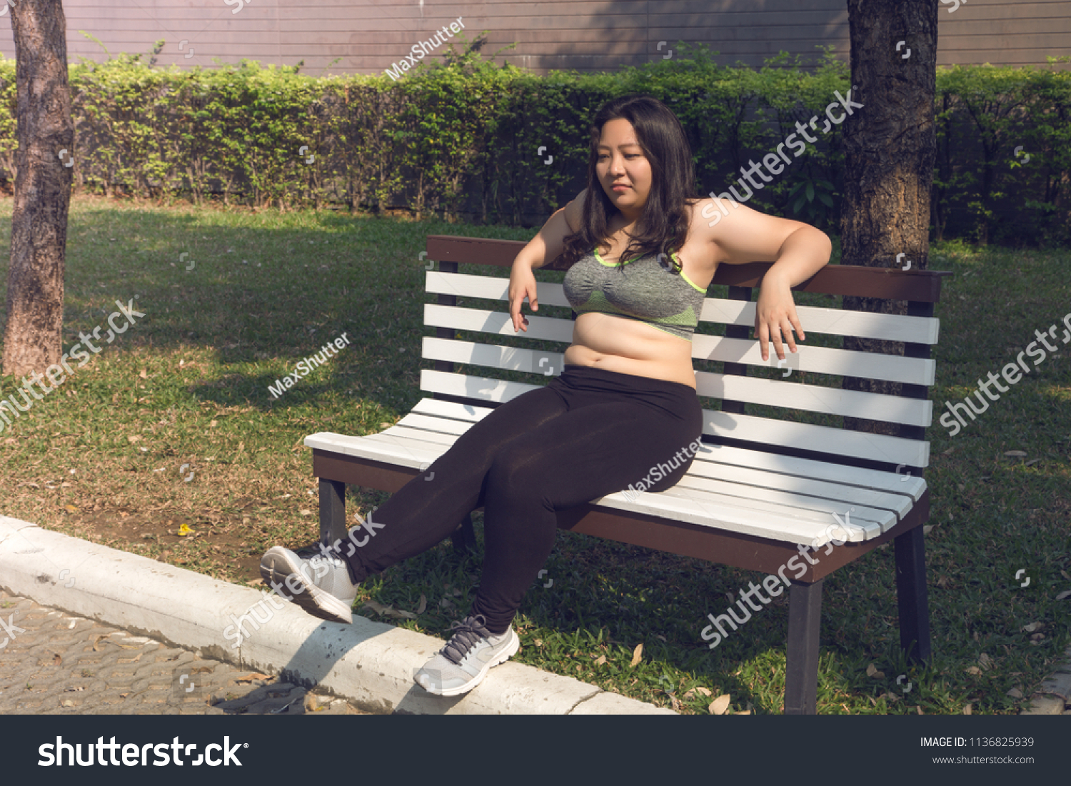Fat Woman Sitting On Chair Relaxing Royalty Free Stock Image