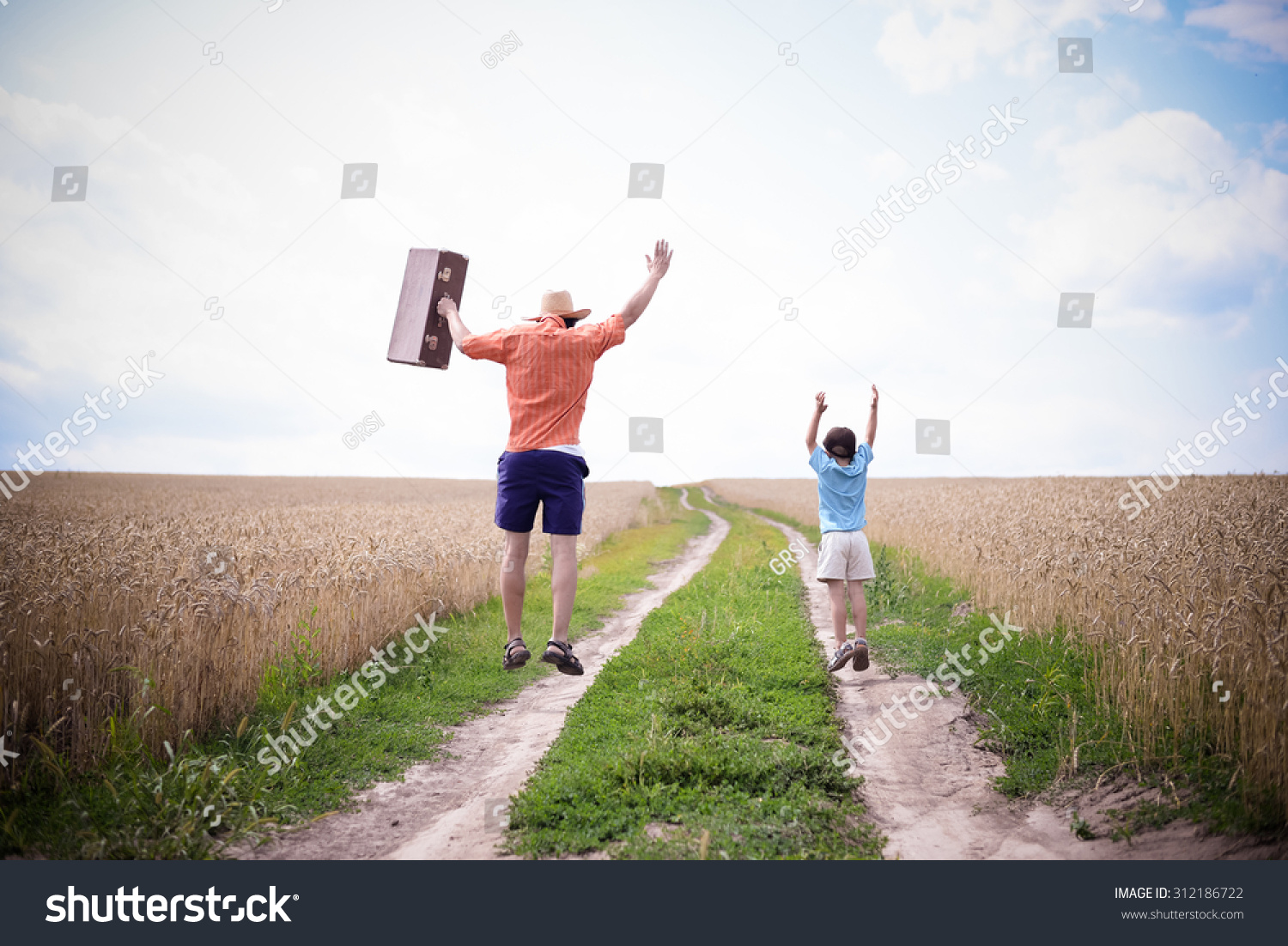 Father Son Jumping On Road Between Stock Photo Edit Now 312186722