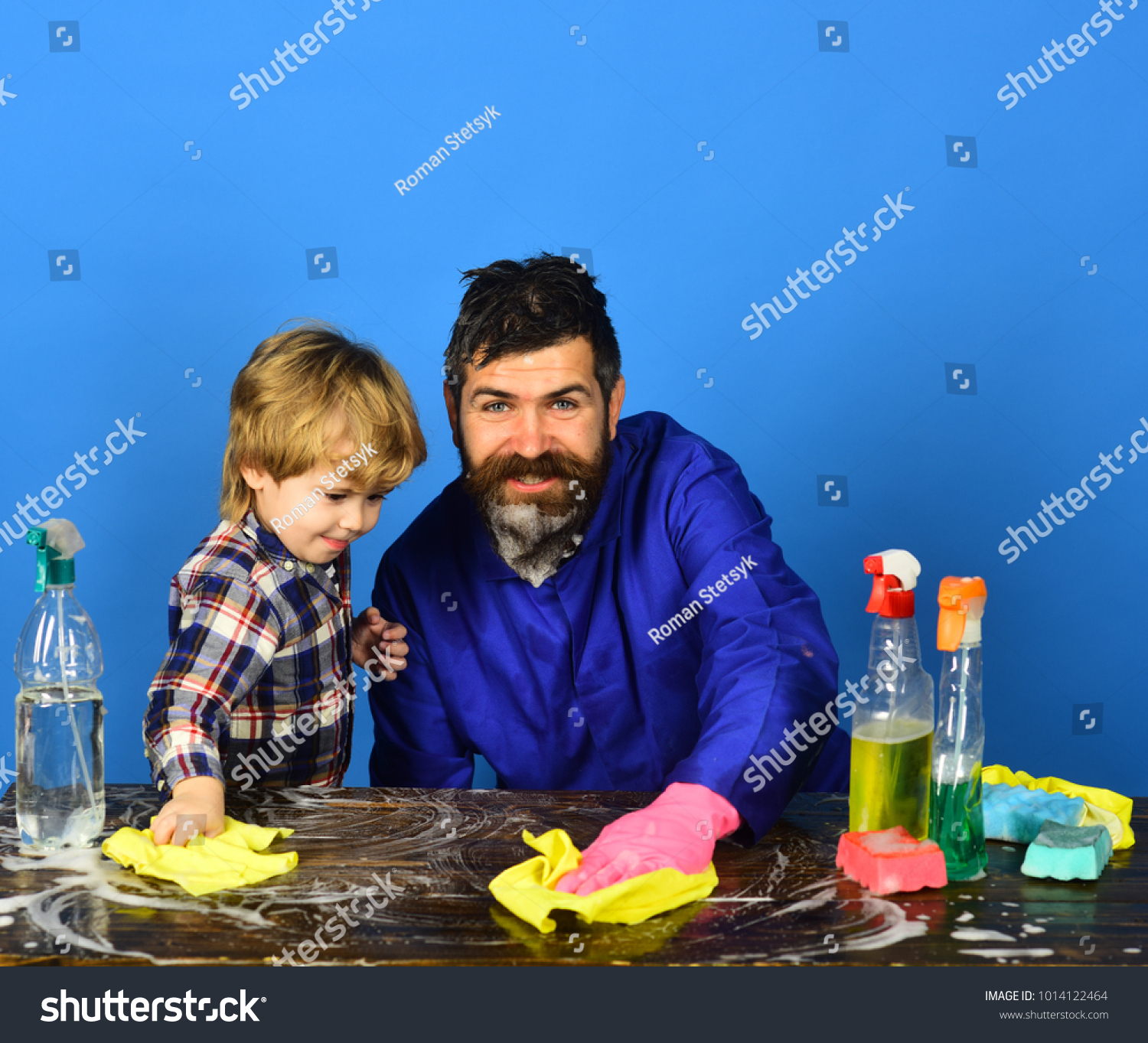 Dad With Son And Cleaning Supplies On Blue Background Man With Beard Dad With Son And Cleaning Supplies On Blue Background Man With Beard