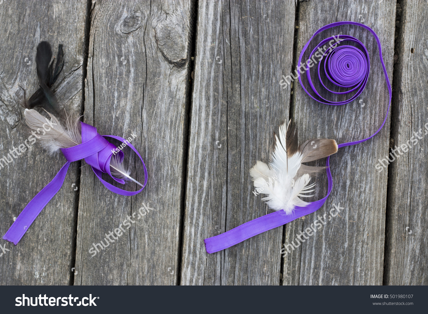 Download Feathers Purple Ribbon On Gray Rustic Stock Photo Edit Now 501980107