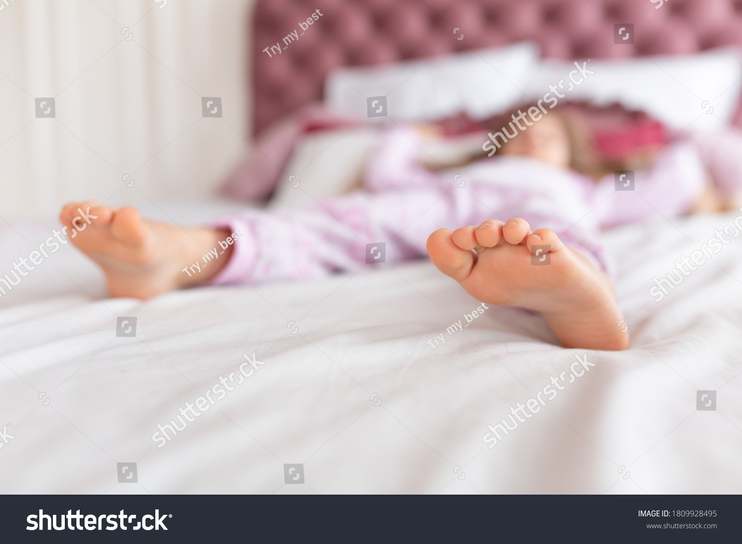 feet-girl-sleeping-comfortable-bed-focus-1809928495-shutterstock