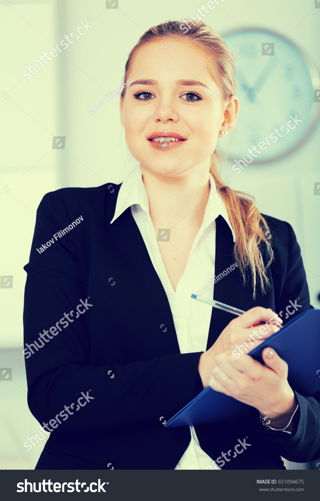 Female Assistant Standing Office Noting Tasks Stock Photo 651094675 ...