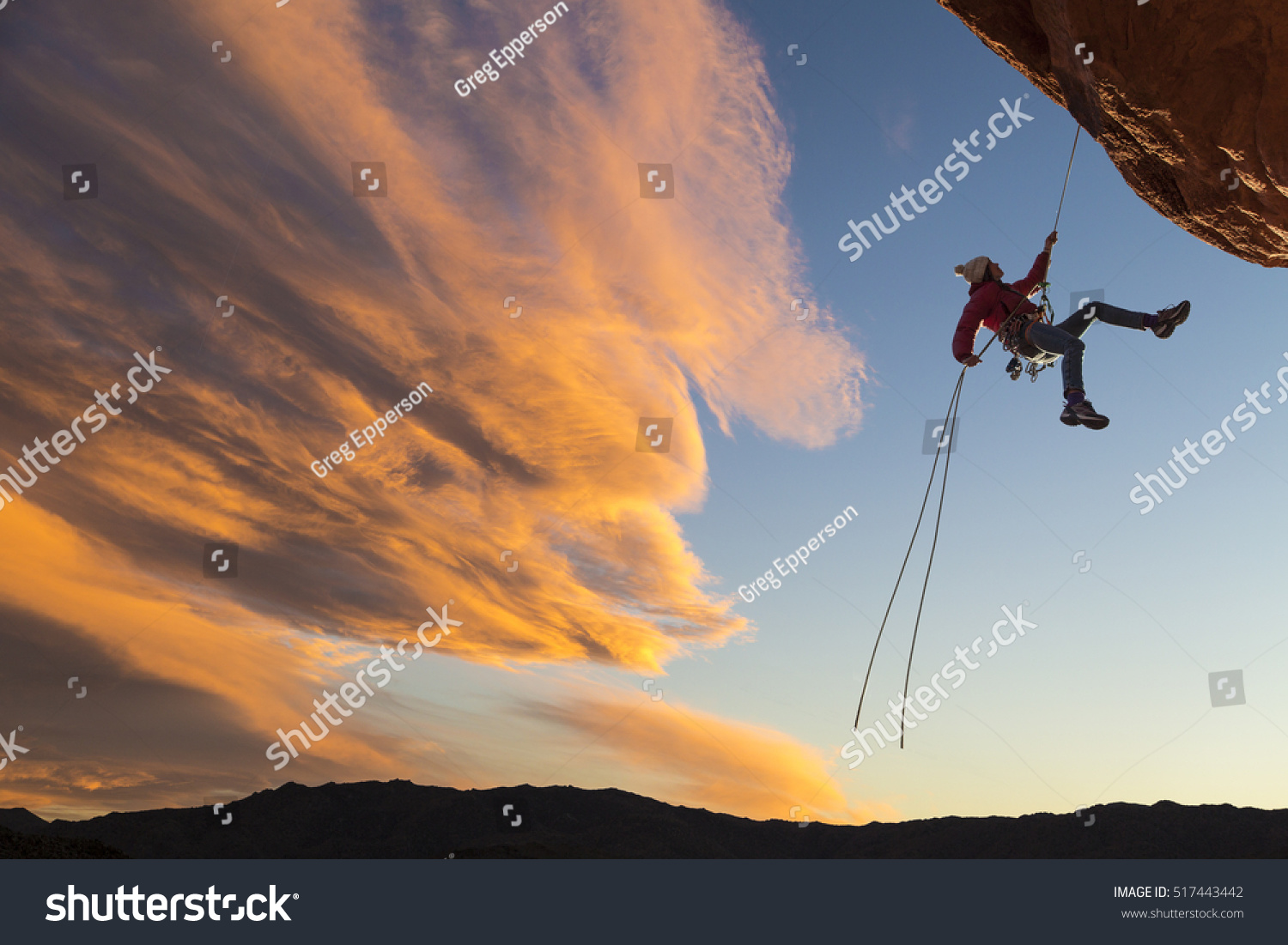 Female Climber Rappelling Down Sheer Cliff Stock Photo Edit Now