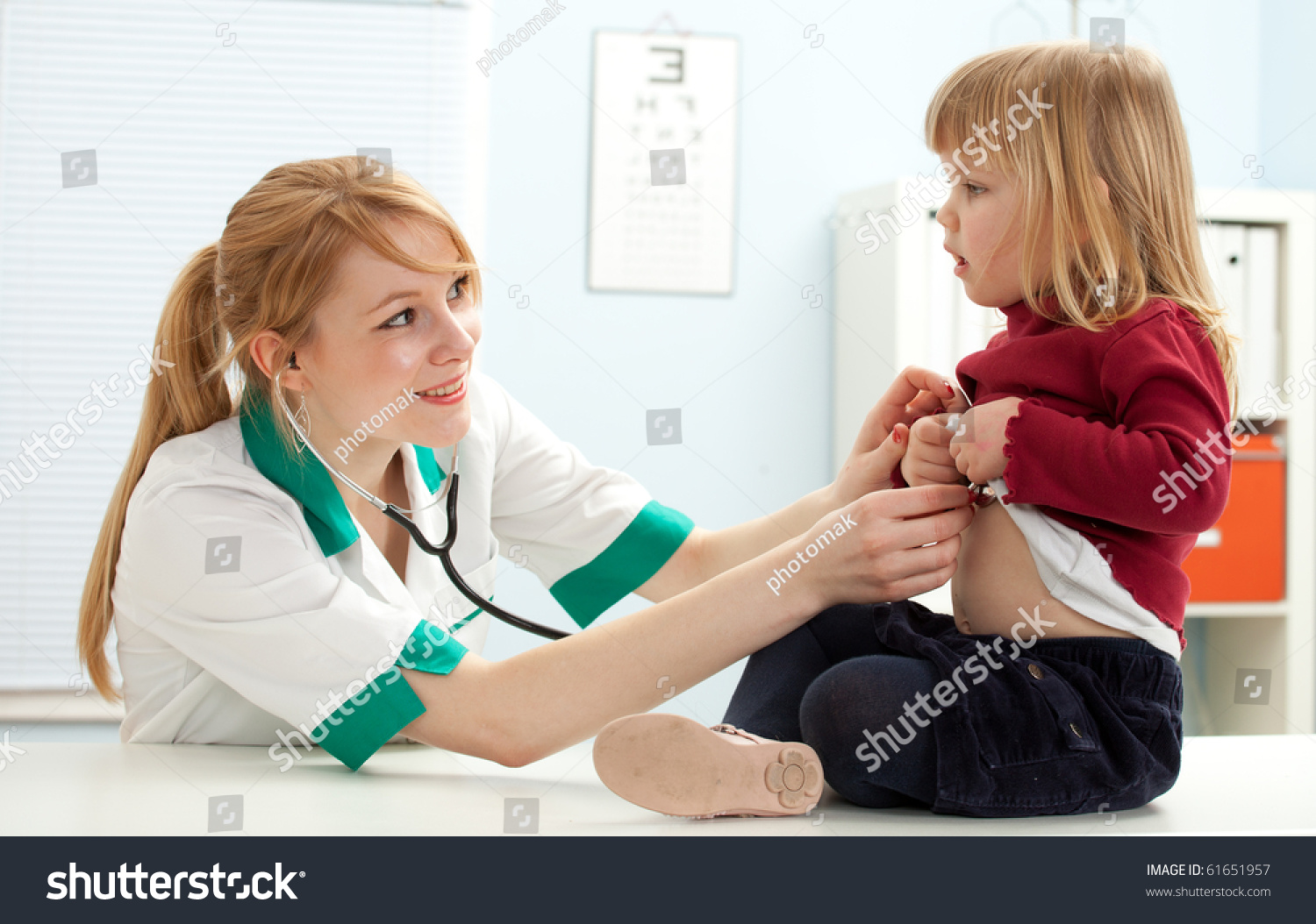 Female Doctor Pediatrician Examining Little Girl Stock Photo 61651957 ...