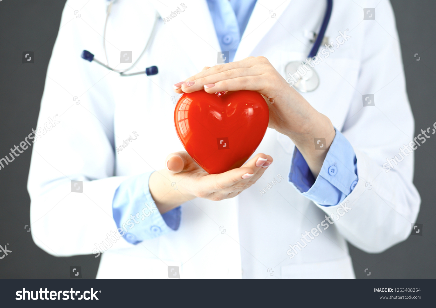 Female Doctor Stethoscope Holding Heart Her Stock Photo 1253408254 ...