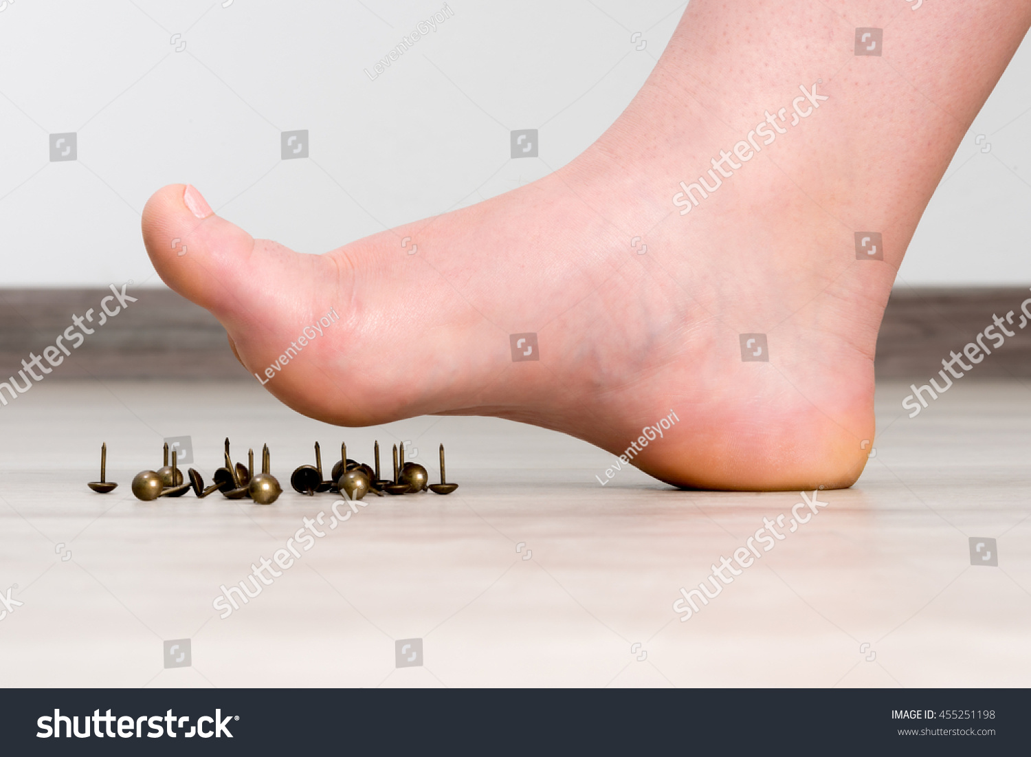 Female Foot Above Pushpin Stock Photo 455251198 : Shutterstock