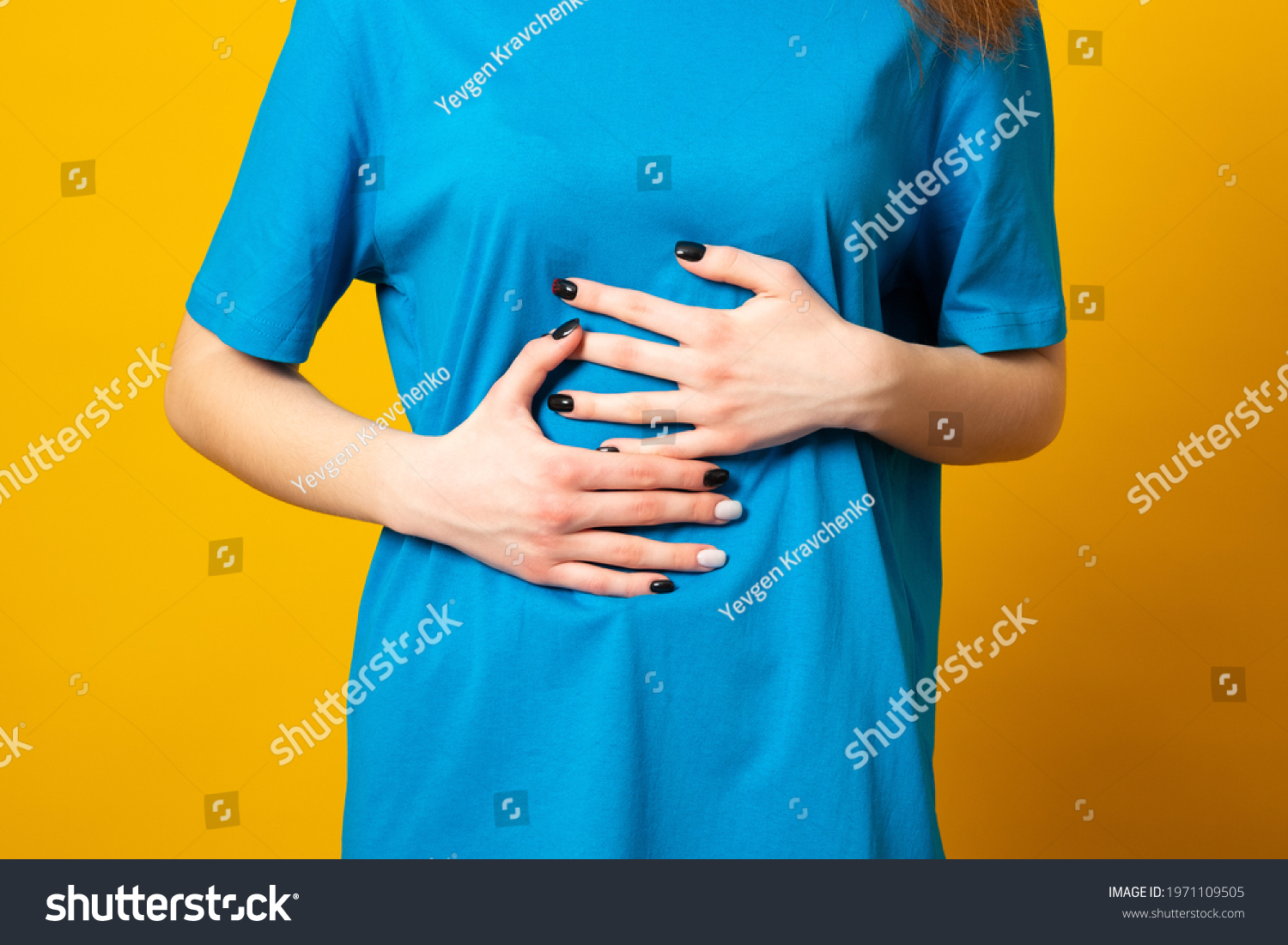 Female Holding Her Stomach Frowns Woman Stock Photo 1971109505