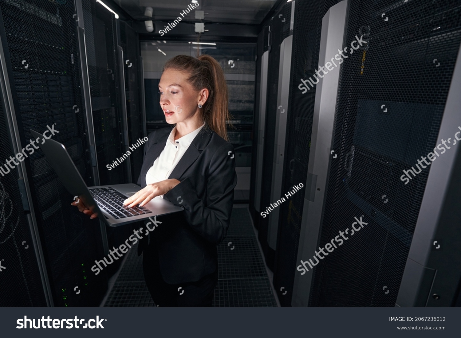 Female Network Manager Working Server Room Stock Photo 2067236012 ...