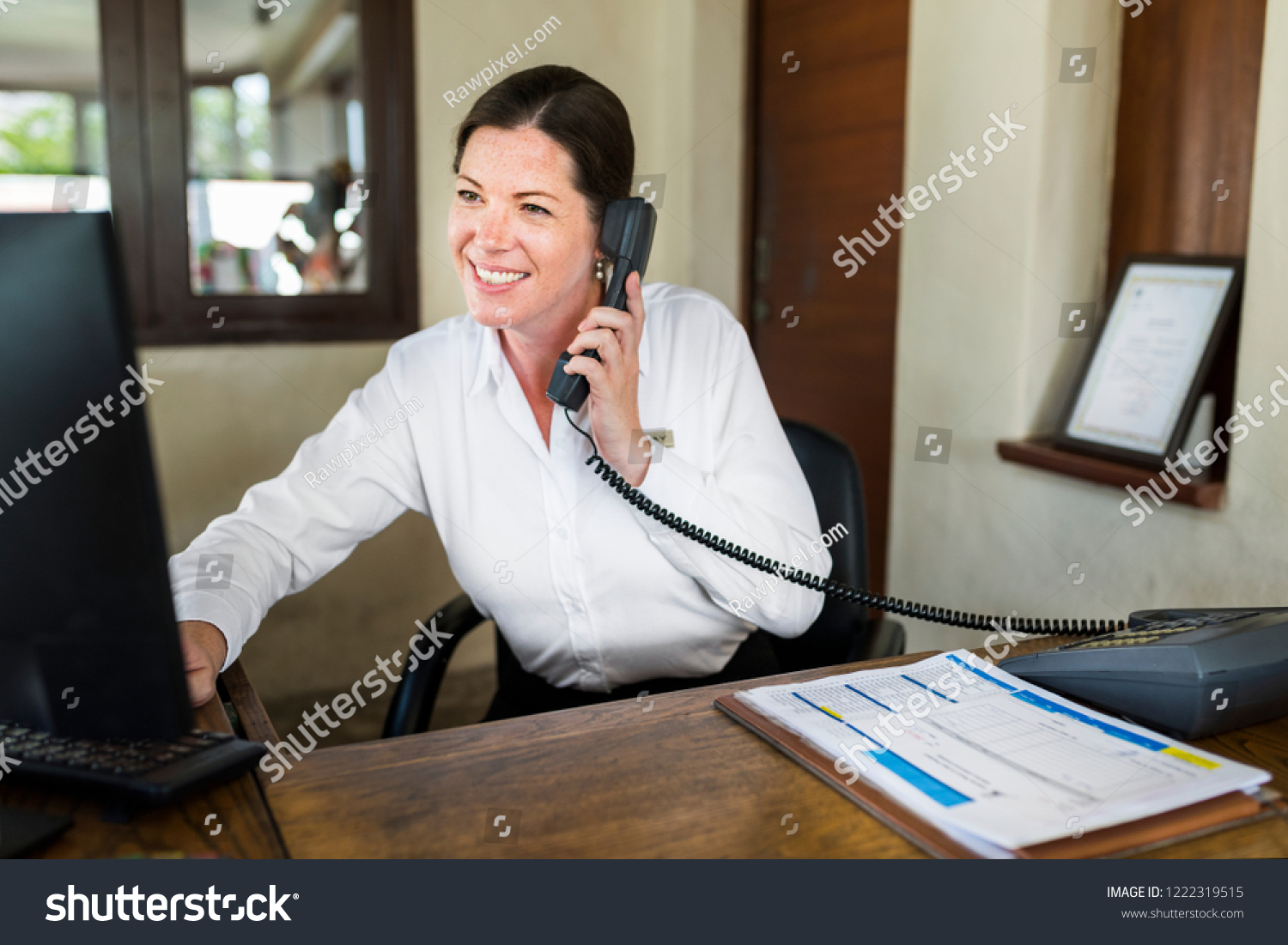 Female Resort Receptionist Working Front Desk Stock Photo Edit