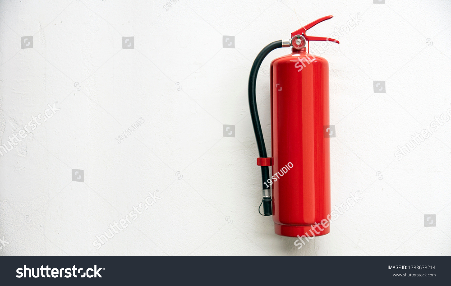 Fire Extinguisher On White Concrete Wall Stock Photo 1783678214 ...