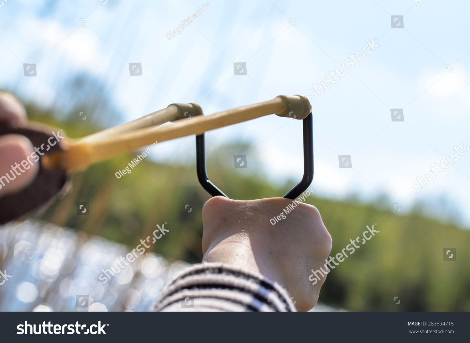 First Person Perspective Of Young Boy Holding Sling Shot, Pulling ...