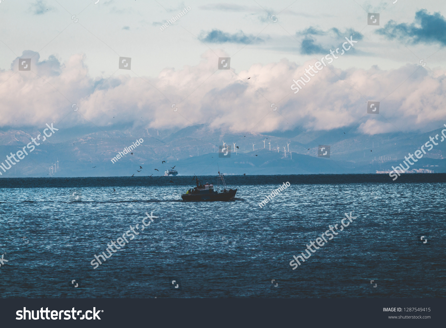 Fishing Boat Sea Under Clouds Coastline Stock Photo Edit Now