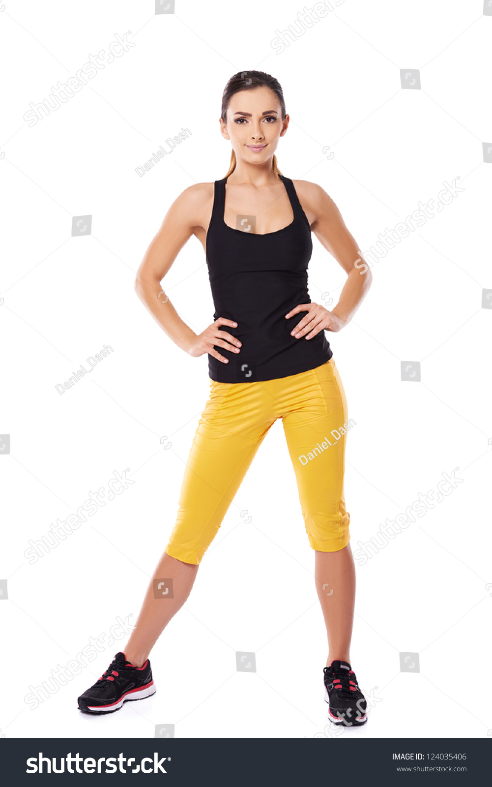 Fit Woman Athlete In Gym Clothes Posing Standing Facing The Camera With ...