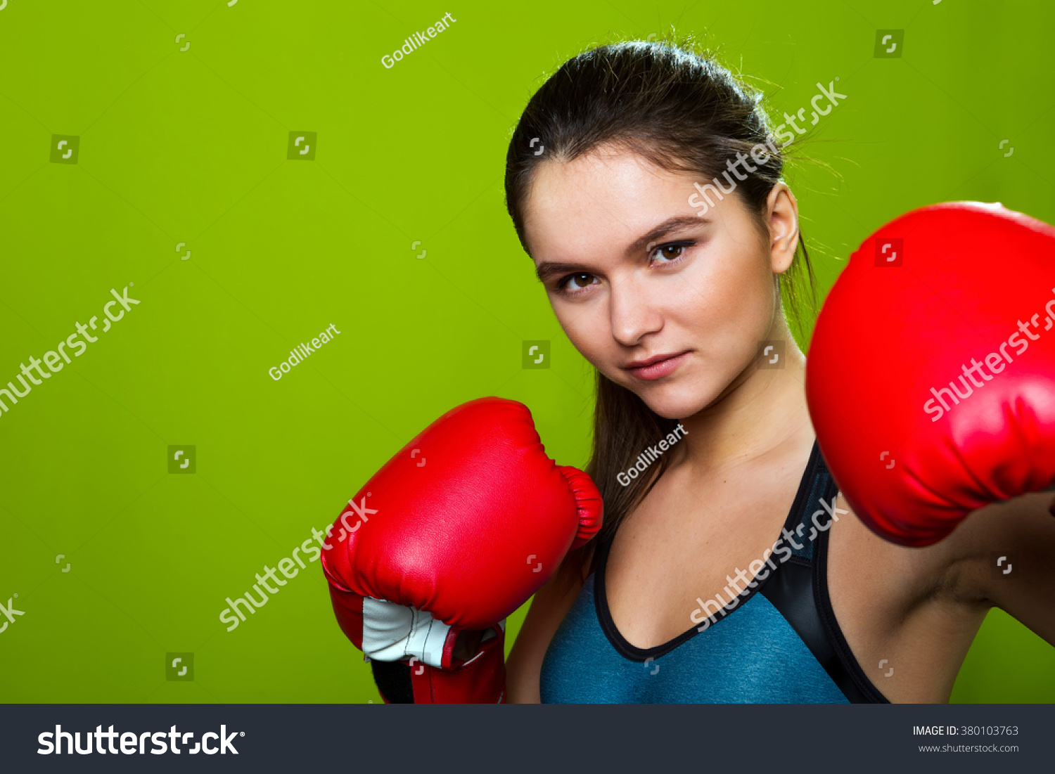 Fitness Girl Model With Serious Face Posing In Boxing Gloves And ...