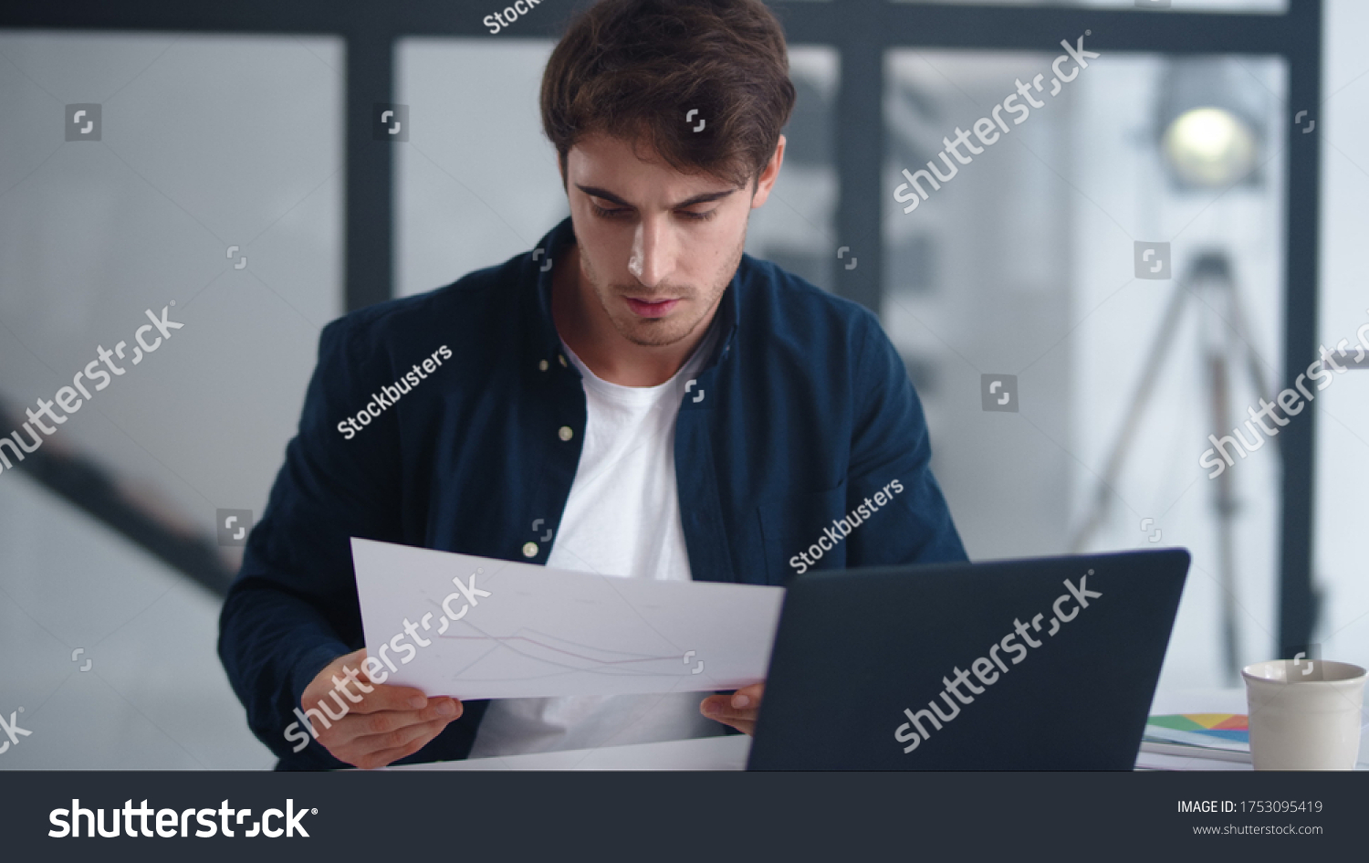 Focused Businessman Reading Document Carefully Serious Stock Photo Shutterstock