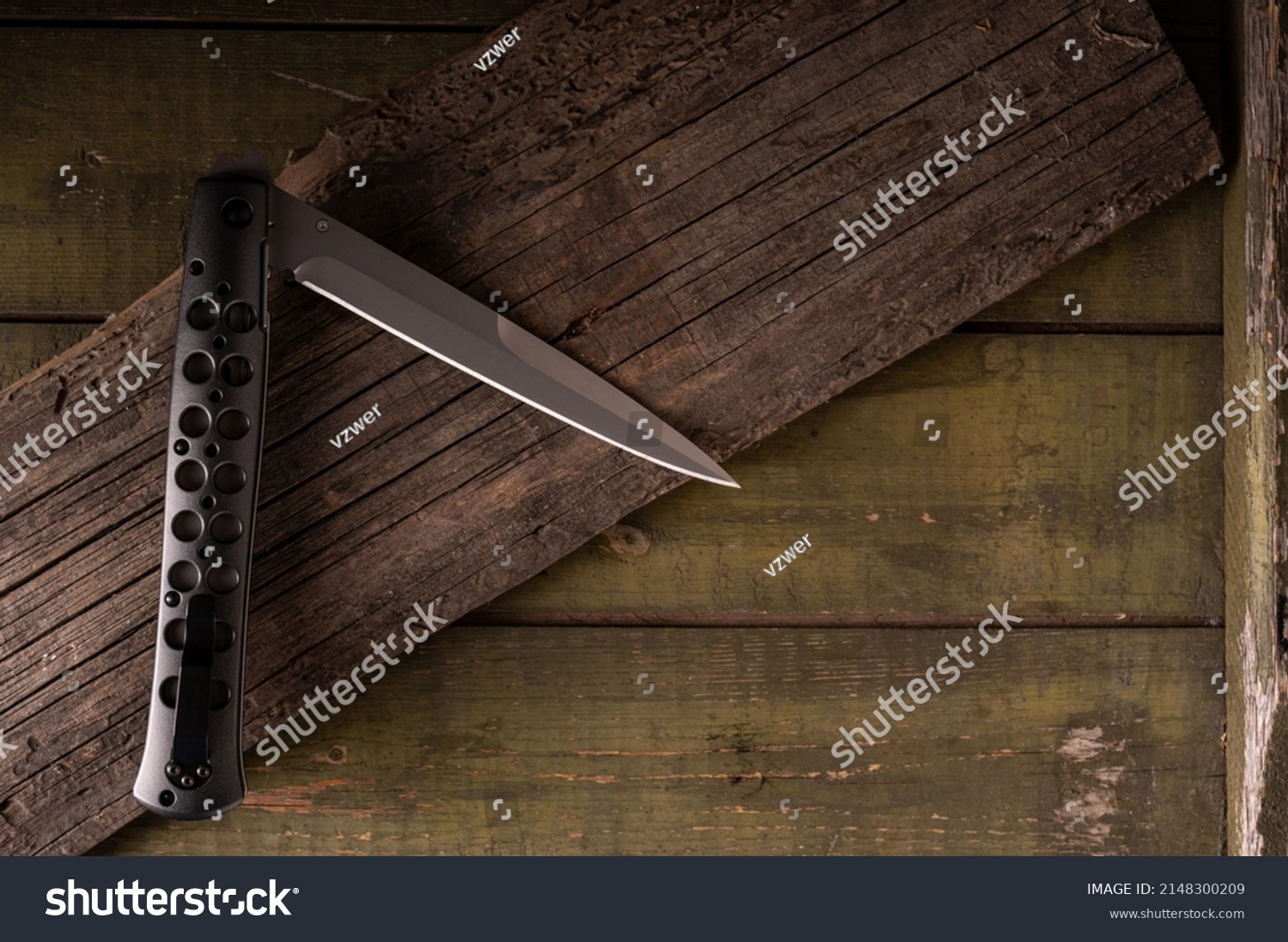 1 139 Folding Big Knife Images Stock Photos Vectors Shutterstock   Stock Photo Folding Knife With Lightweight Handle Knife Handle With Holes Knife On A Wooden Background Sharp 2148300209 