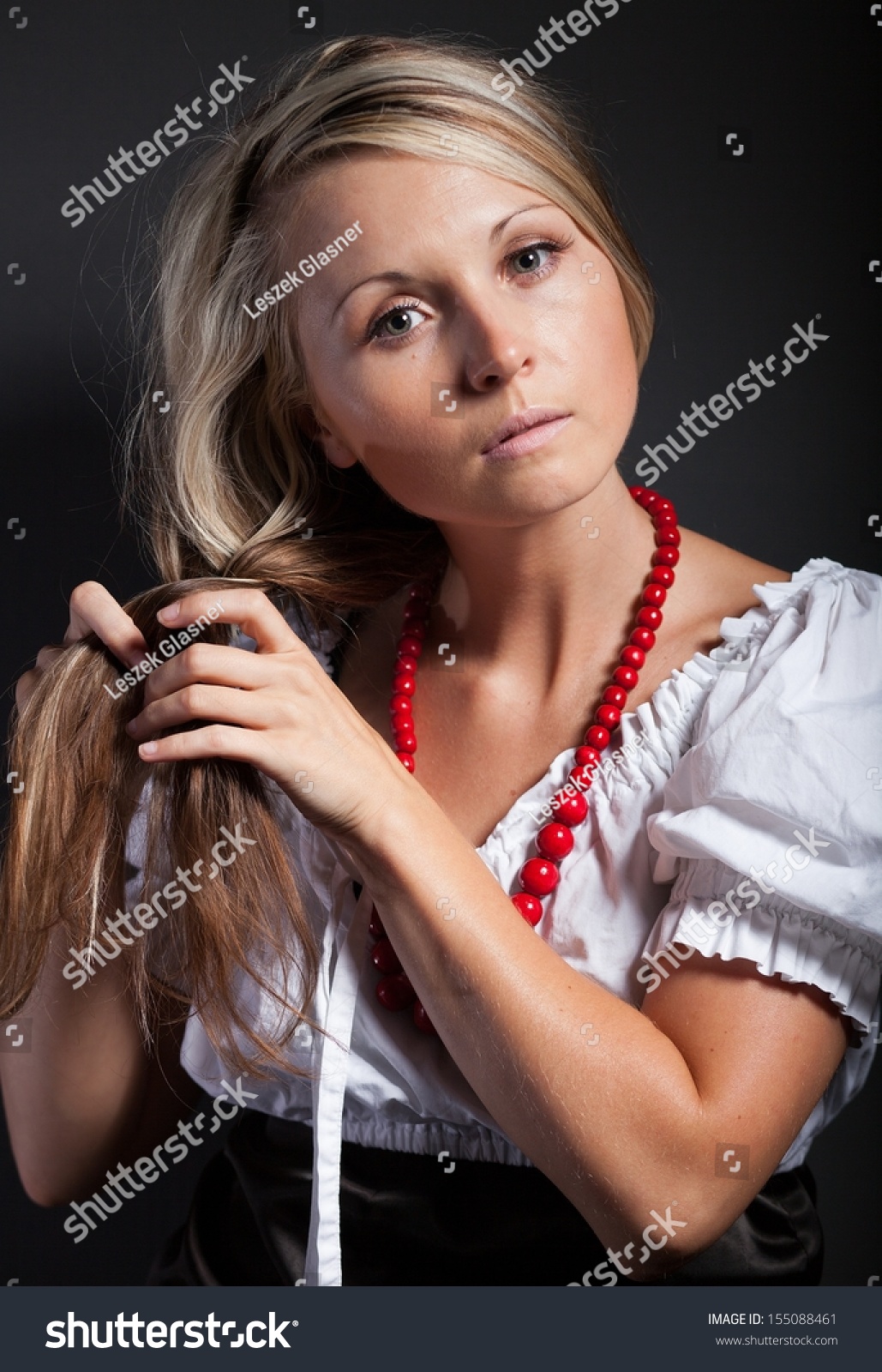 Folk Woman In Folklore Clothes From Europe Braiding A Plait Stock Photo ...