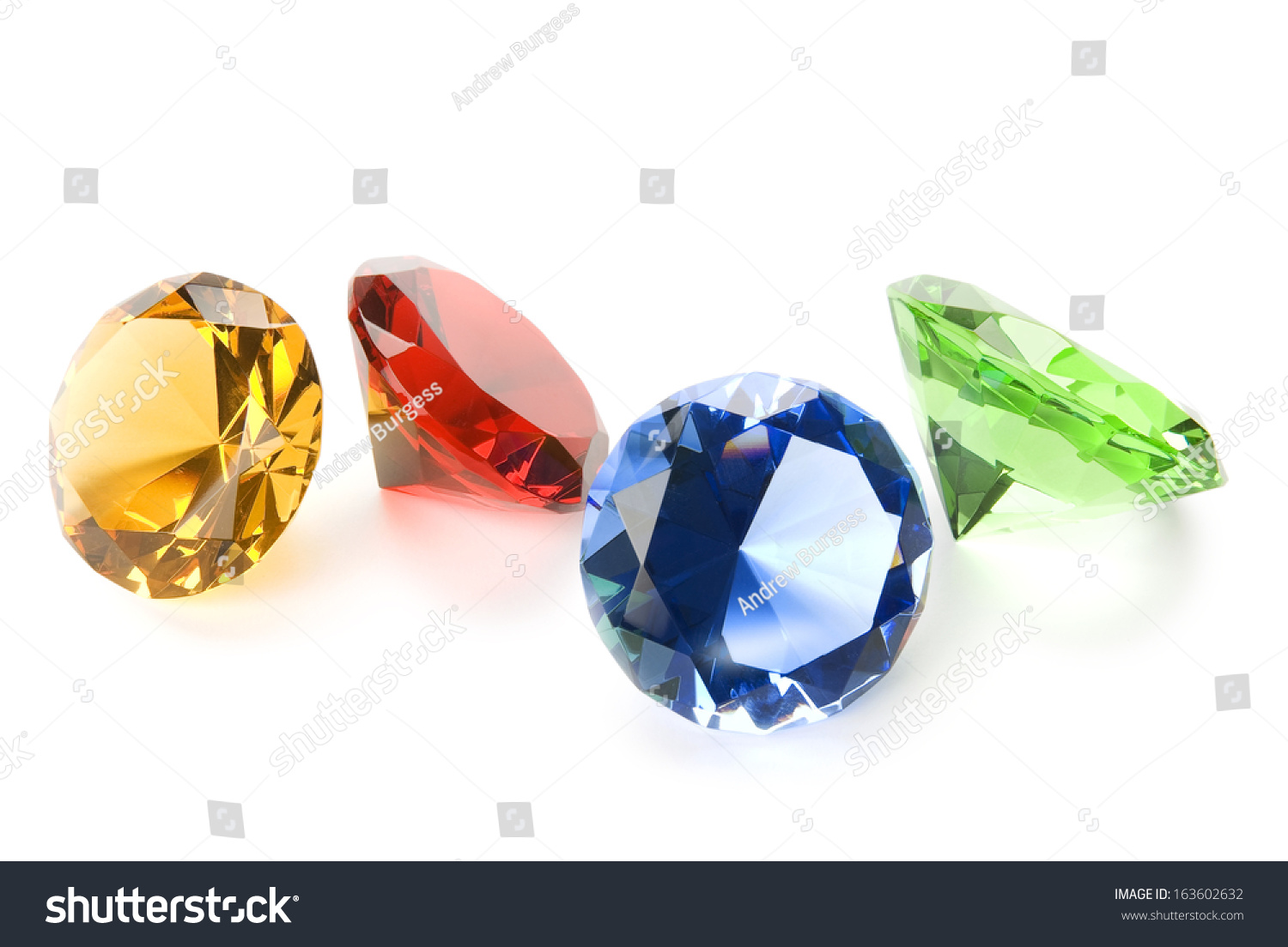 Four Gemstones, Yellow, Red, Blue And Green Isolated On White With Soft ...