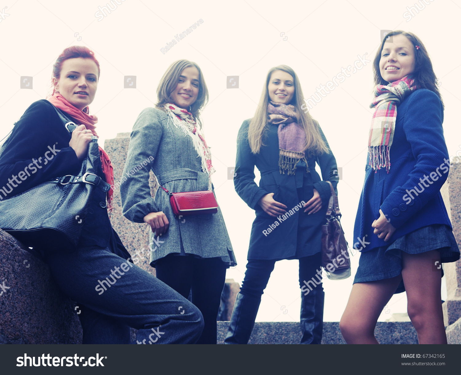 Four Women Walking Along The Street Together Stock Photo 67342165 ...