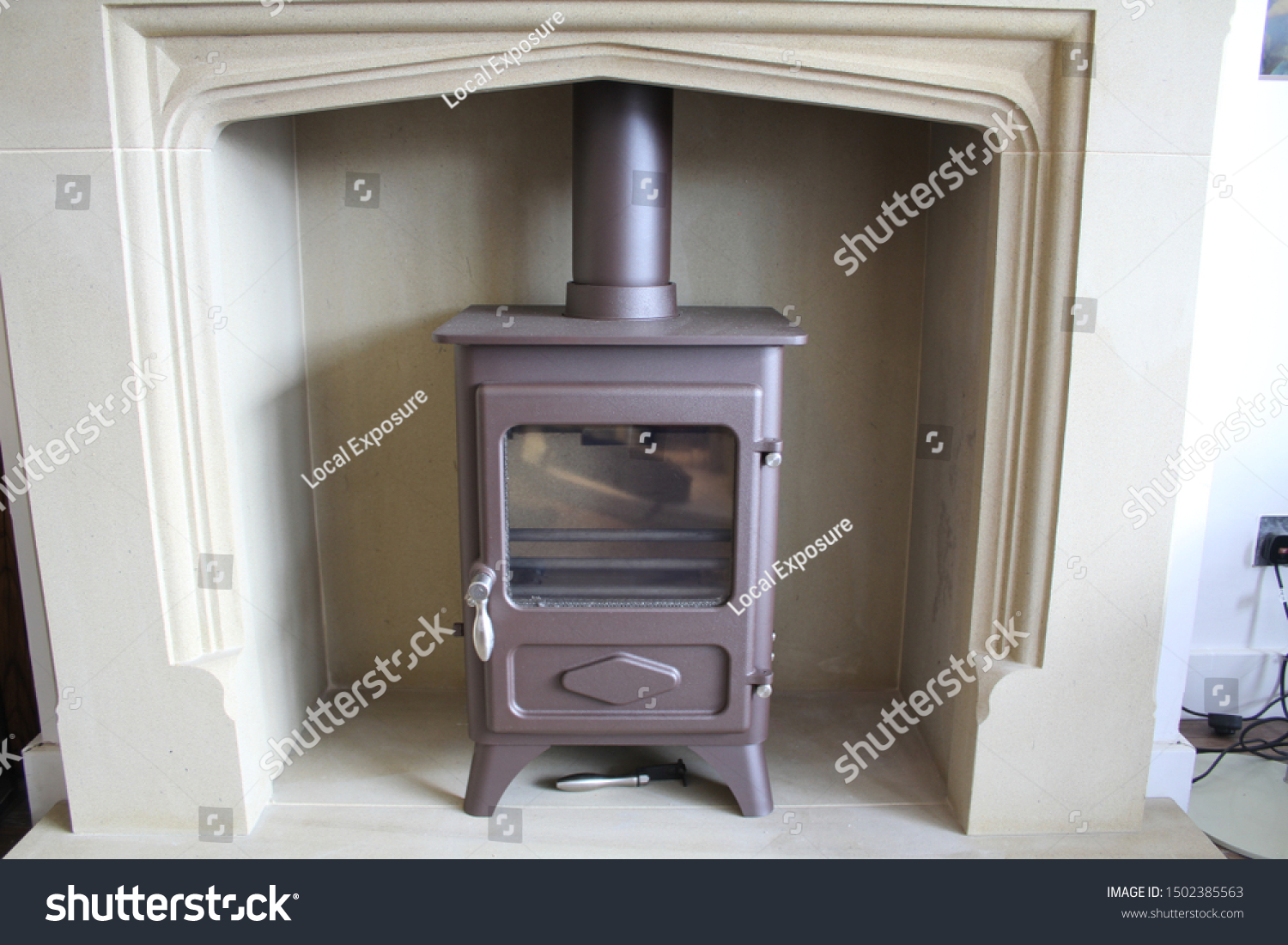 Freestanding Log Burning Fireplace White Surround Stock Image