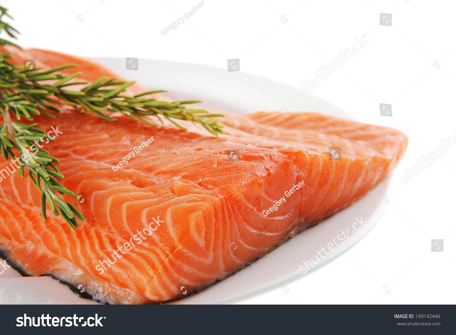 Fresh Raw Red Fish Fillet On White Plate And Rosemary Stock Photo ...