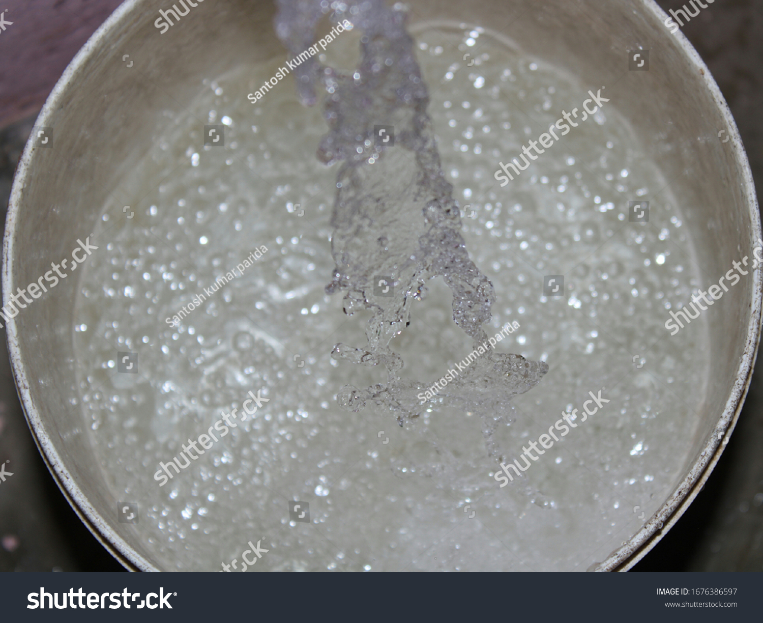 Fresh Water Dropping Bucket Water Background Stock Photo 1676386597