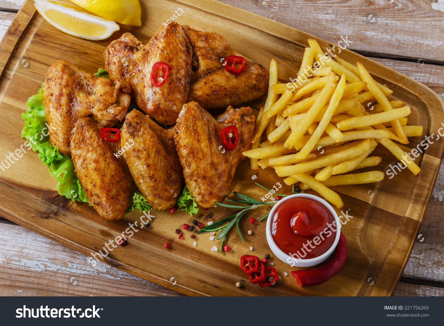 Fried Chicken Wings With Red Sauce And French Fries Stock Photo ...