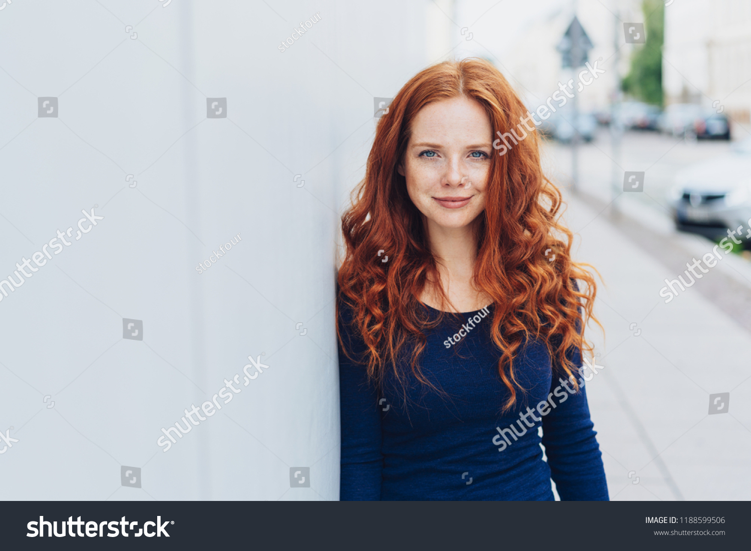 Sexy woman leaning against wall Stock Photos, Images & Photography ...