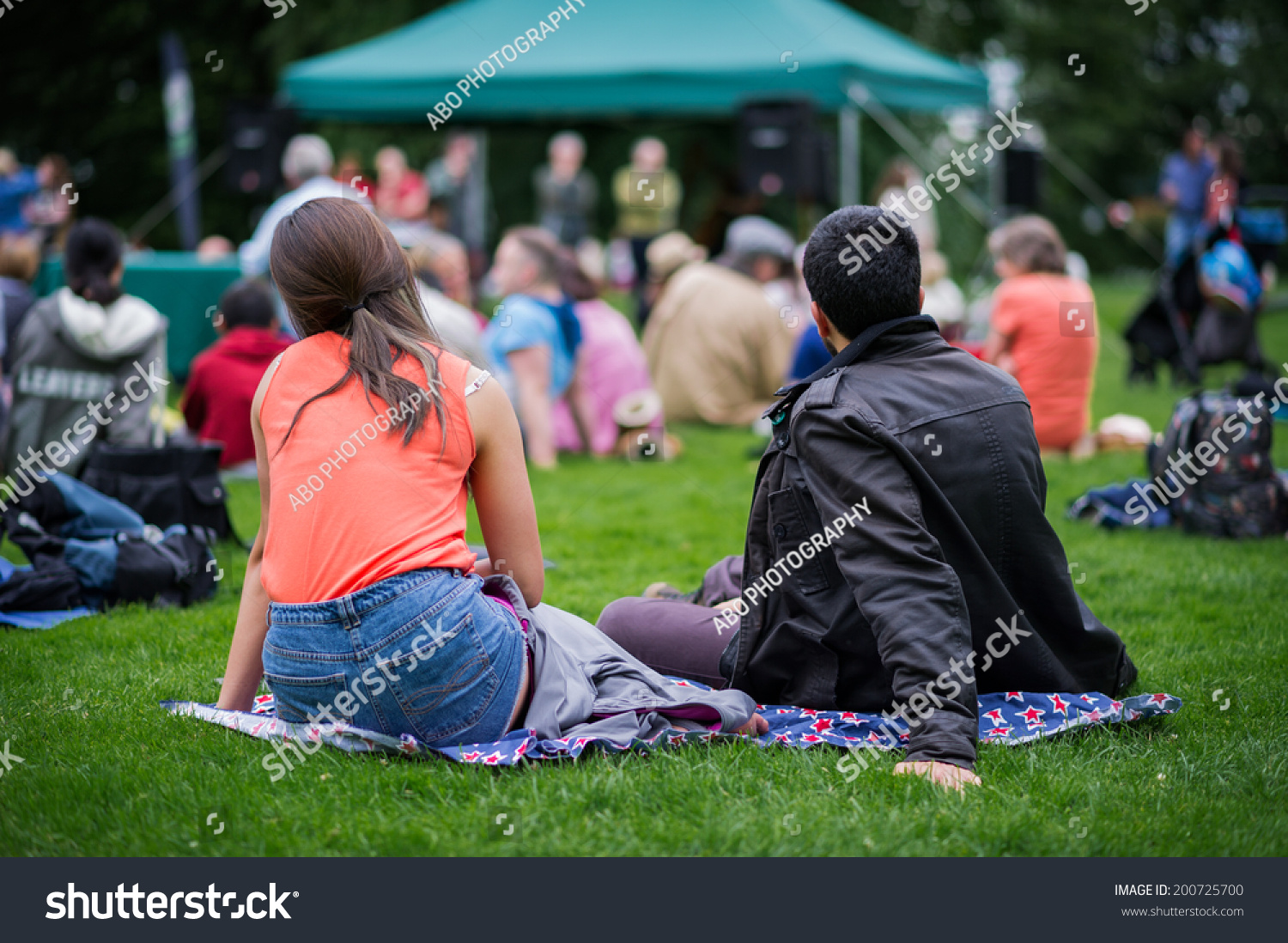 Friends Sitting On Grass Enjoying Outdoors Stock Photo 200725700 ...